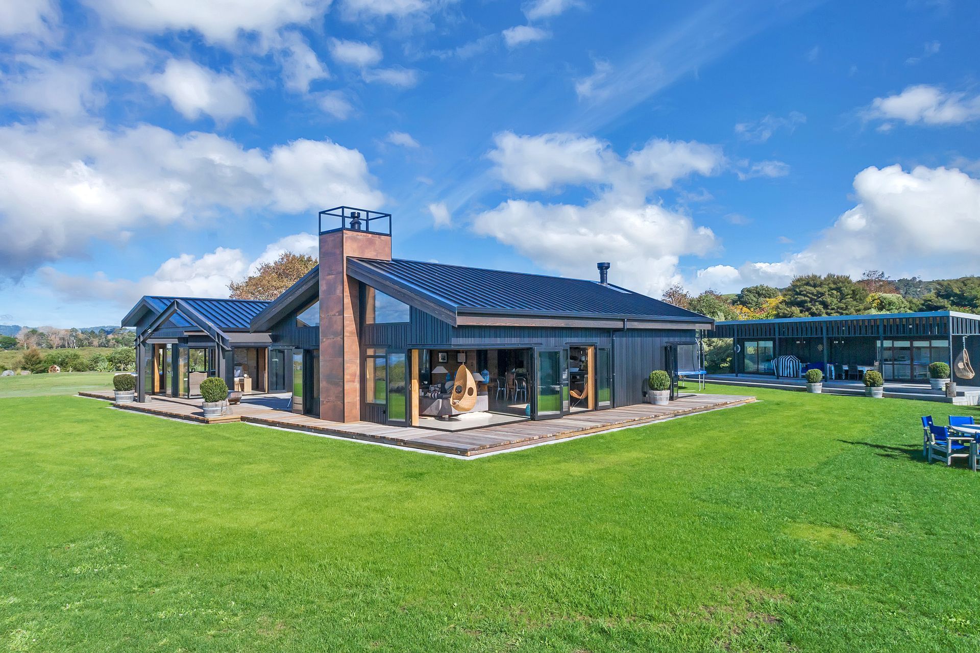 The 430m² home is orientated to the coast, with sheltered outdoor areas and rooms that open directly up to the outside and featured recycled and crafted elements.