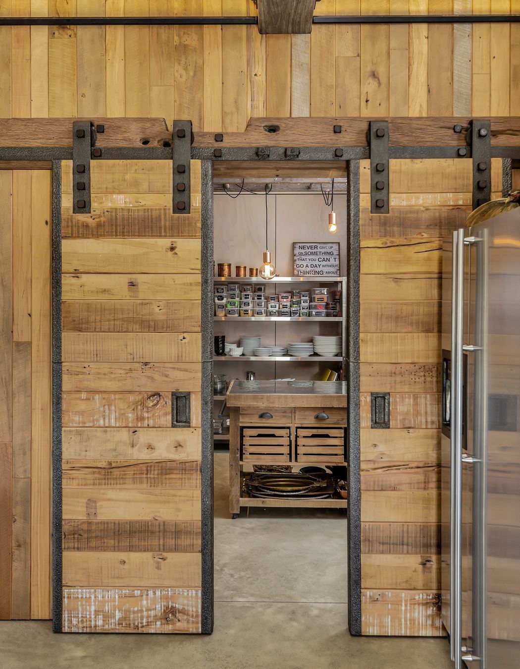 Sliding barn doors off the kitchen reveal a large scullery.