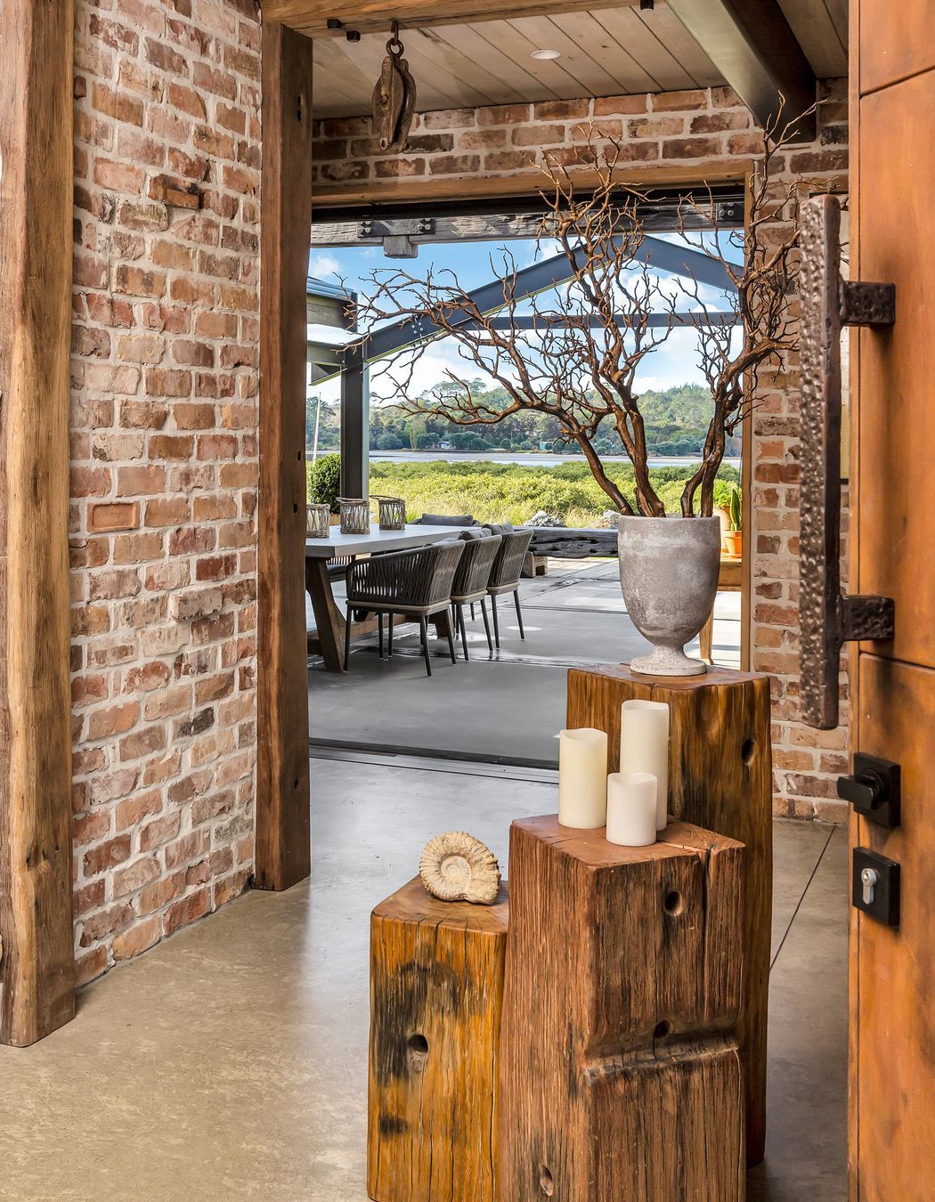 A glimpse of the water from the bricked entranceway.