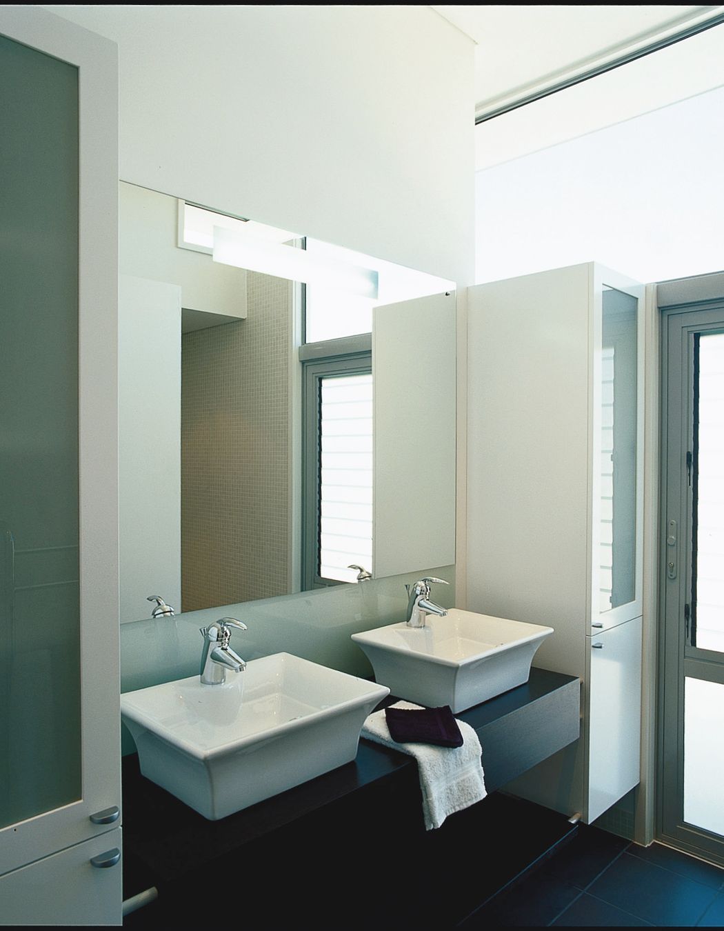 Ensuite Bathroom, mosaic tiled walk-in shower. High level glazing provides an abundance of light without compromising privacy.