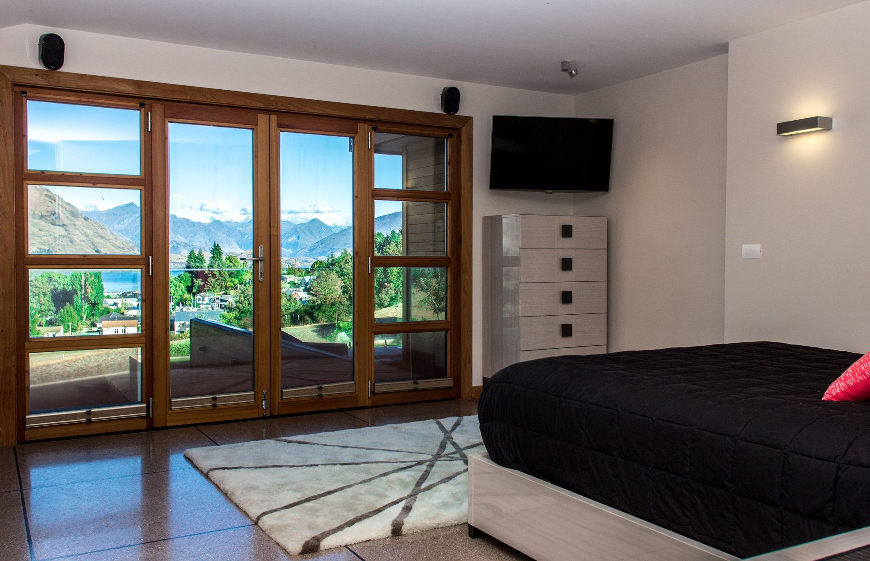 The view from the Master Bedroom, across Lake Wanaka to the mountains beyond.
