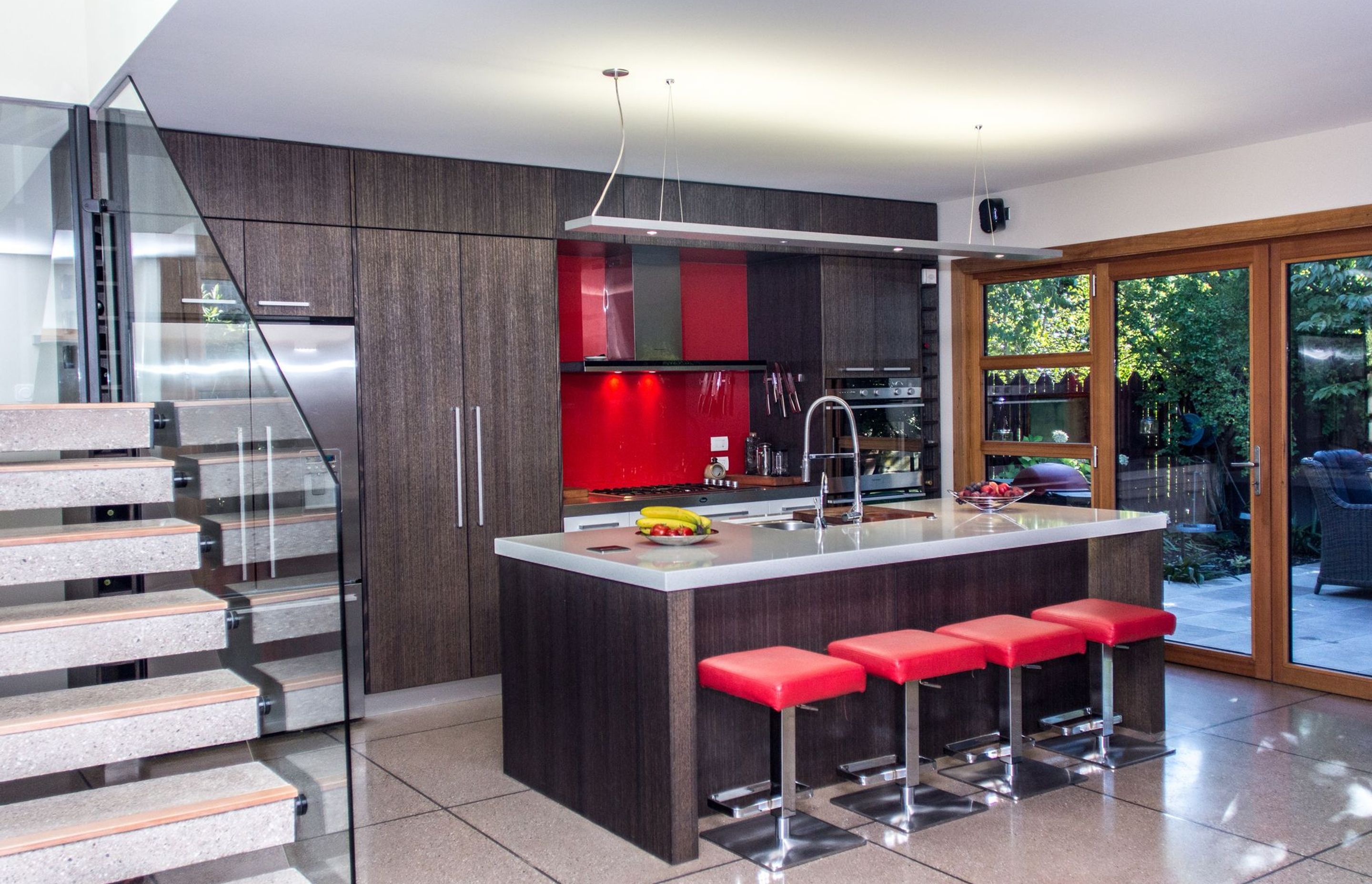 The bright colours of the kitchen add contrast and interest.