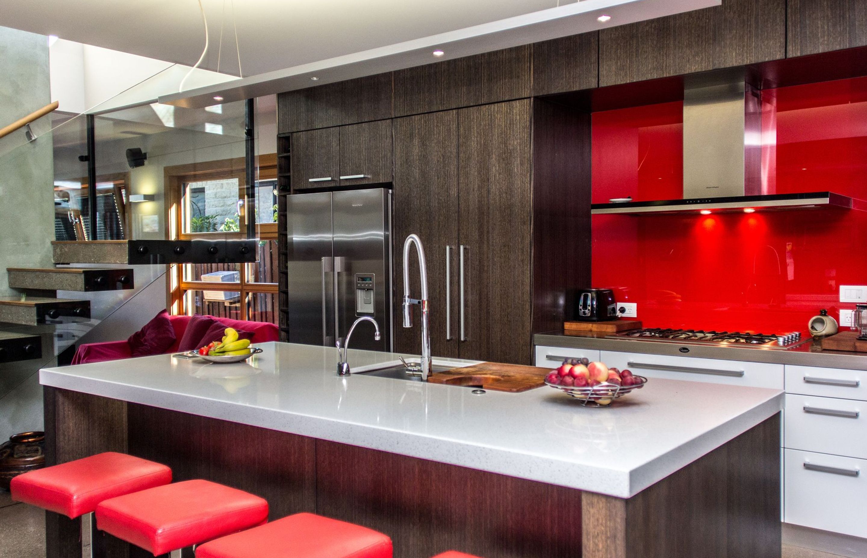 The bright colours of the kitchen add contrast and interest.