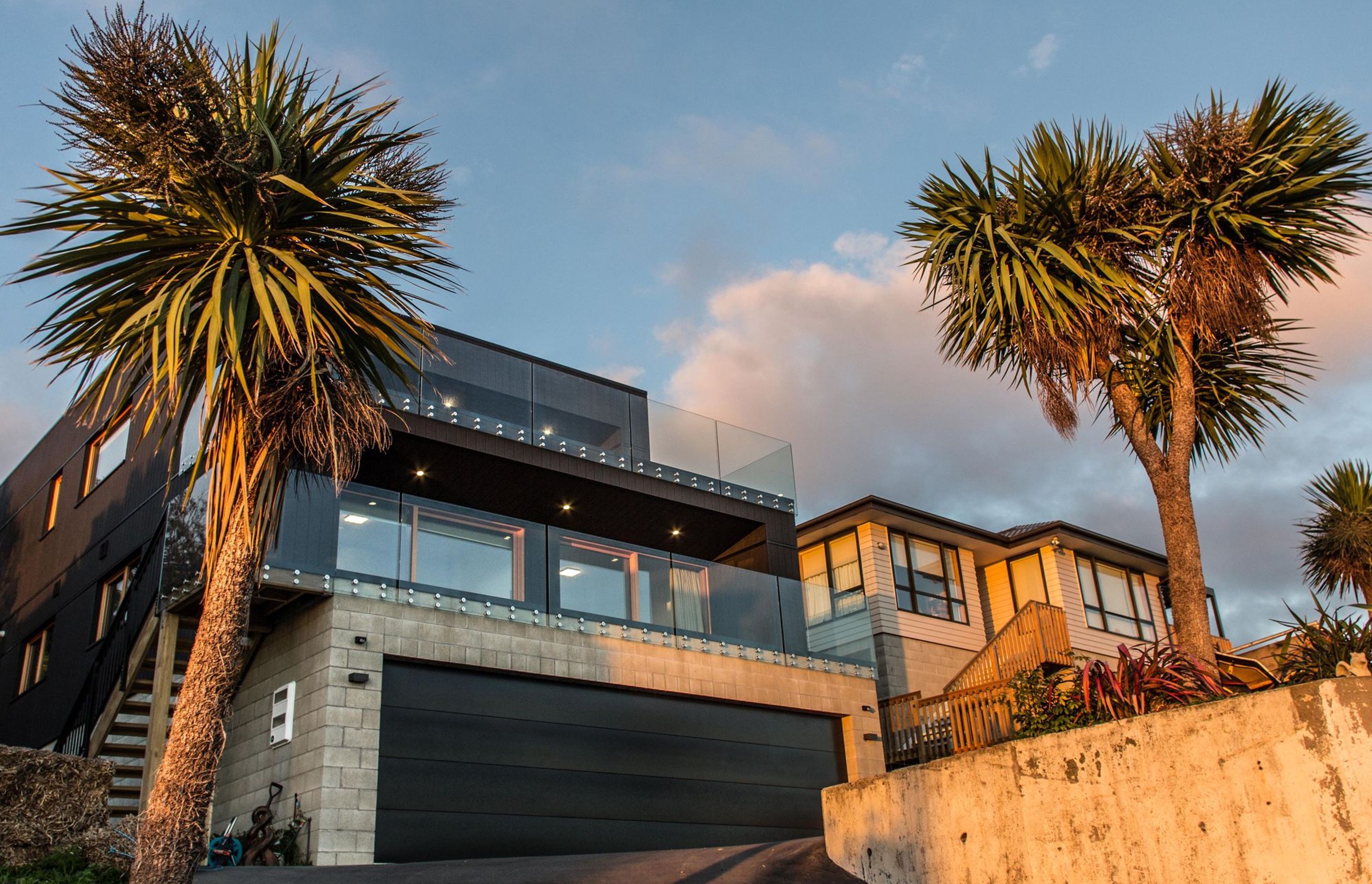 The home is formed by a series of simple blocks cascading down the steep hill site.