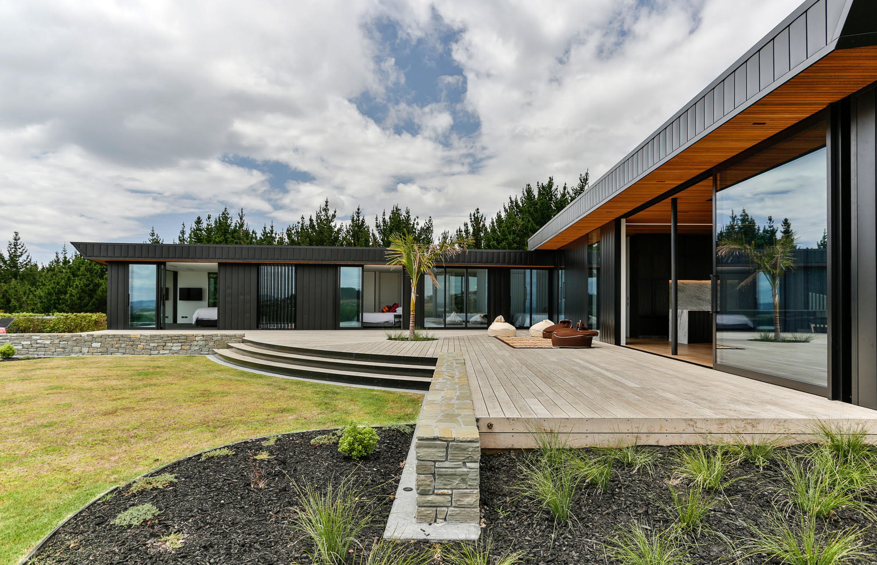 An expansive north-facing deck is one of two outdoor spaces that lead off the living wing, the other is oriented to the southeast.