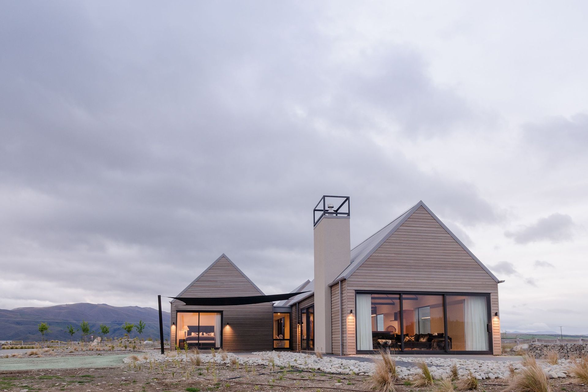 The home nestles nicely into the iconic golden setting of the MacKenzie Country.