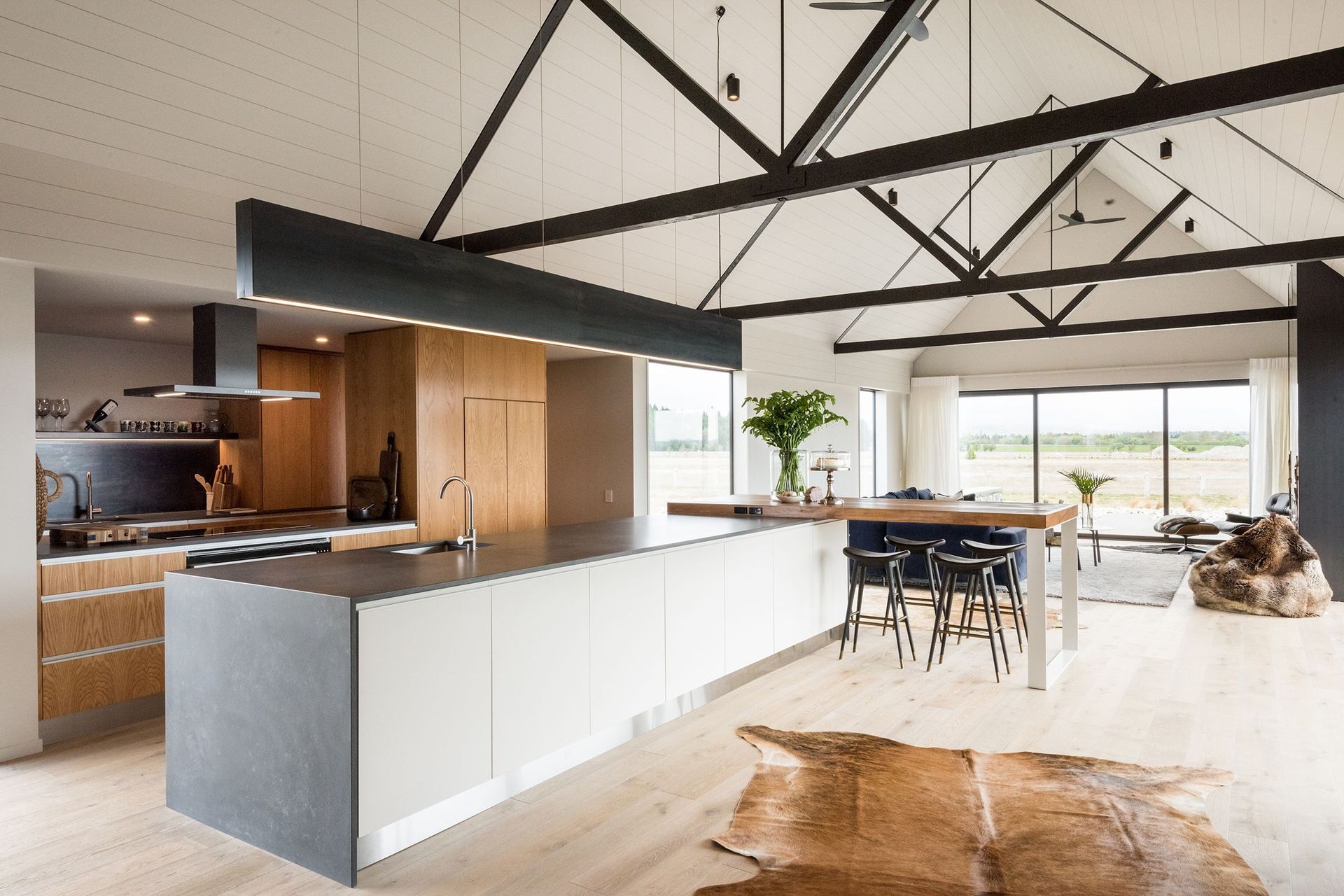 Main pavilion area with a gabled ceiling, framed by impressive timber trusses