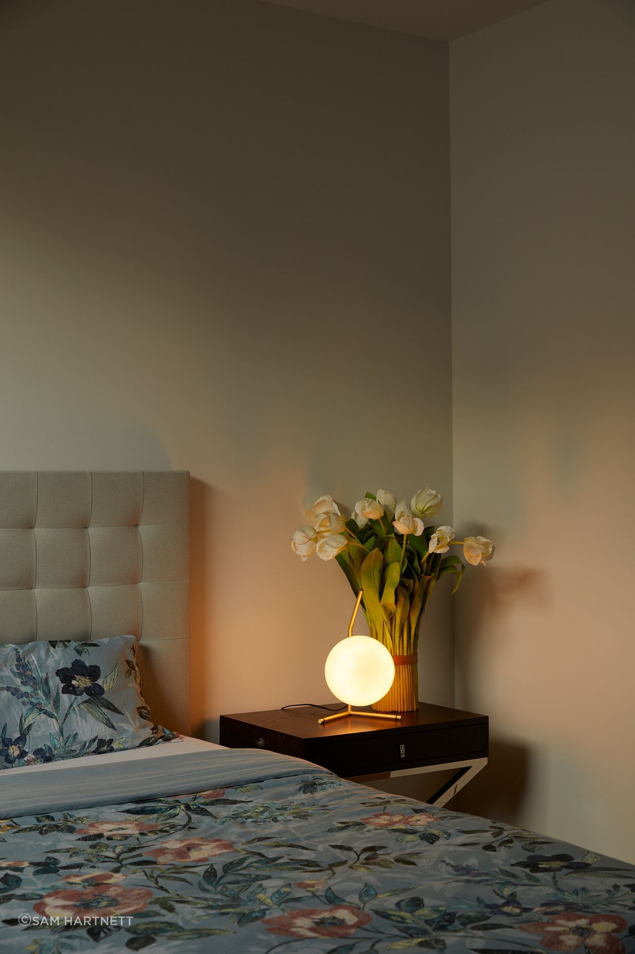 A private retreat, the guest bedroom is nestled into the back of the house.