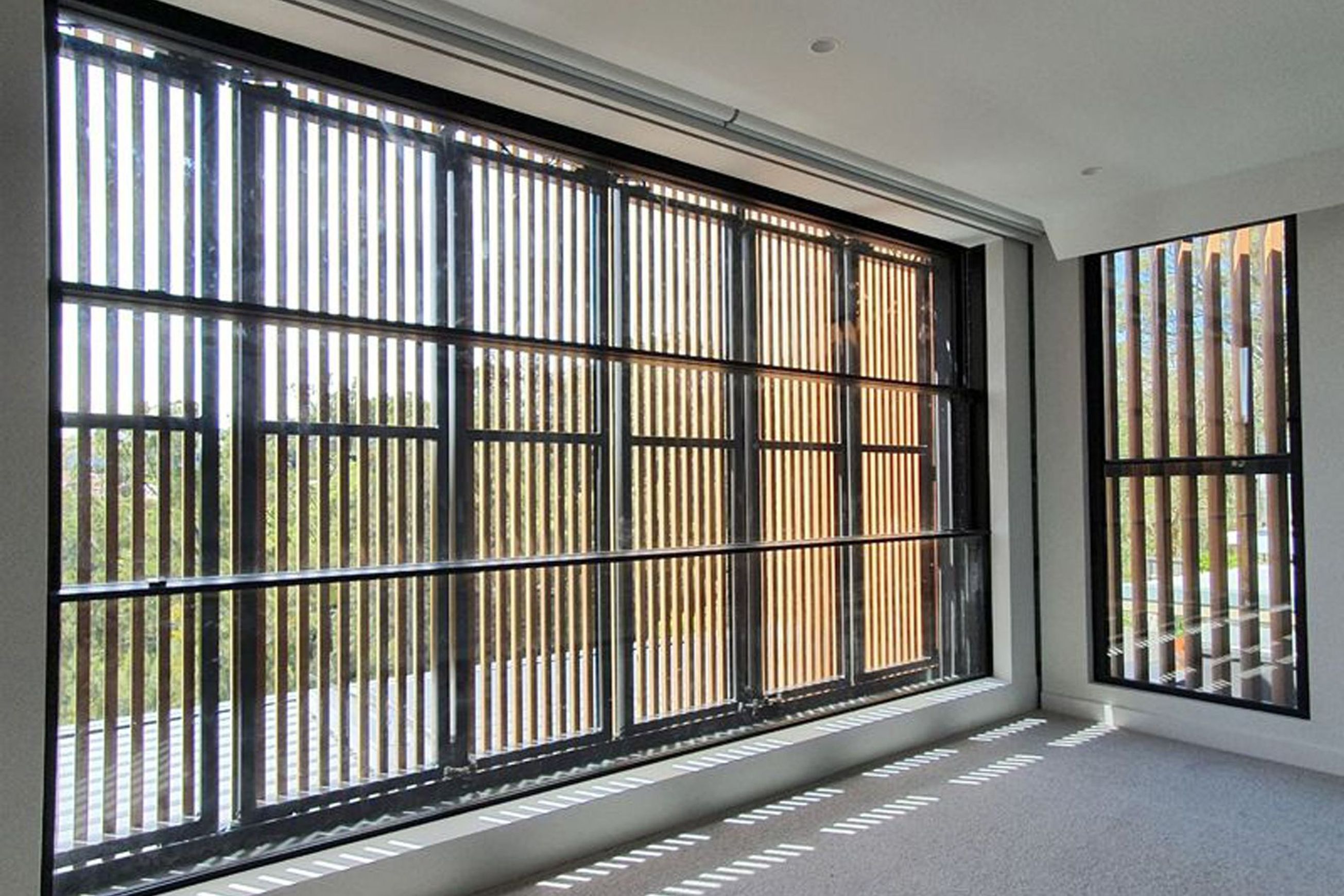 Motorised Vertical Bi-Fold Screens | Shade Factor