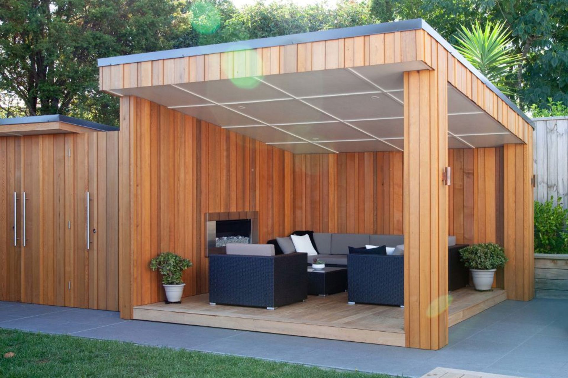 Cedar clad outside entertainment area with inbuilt fireplace