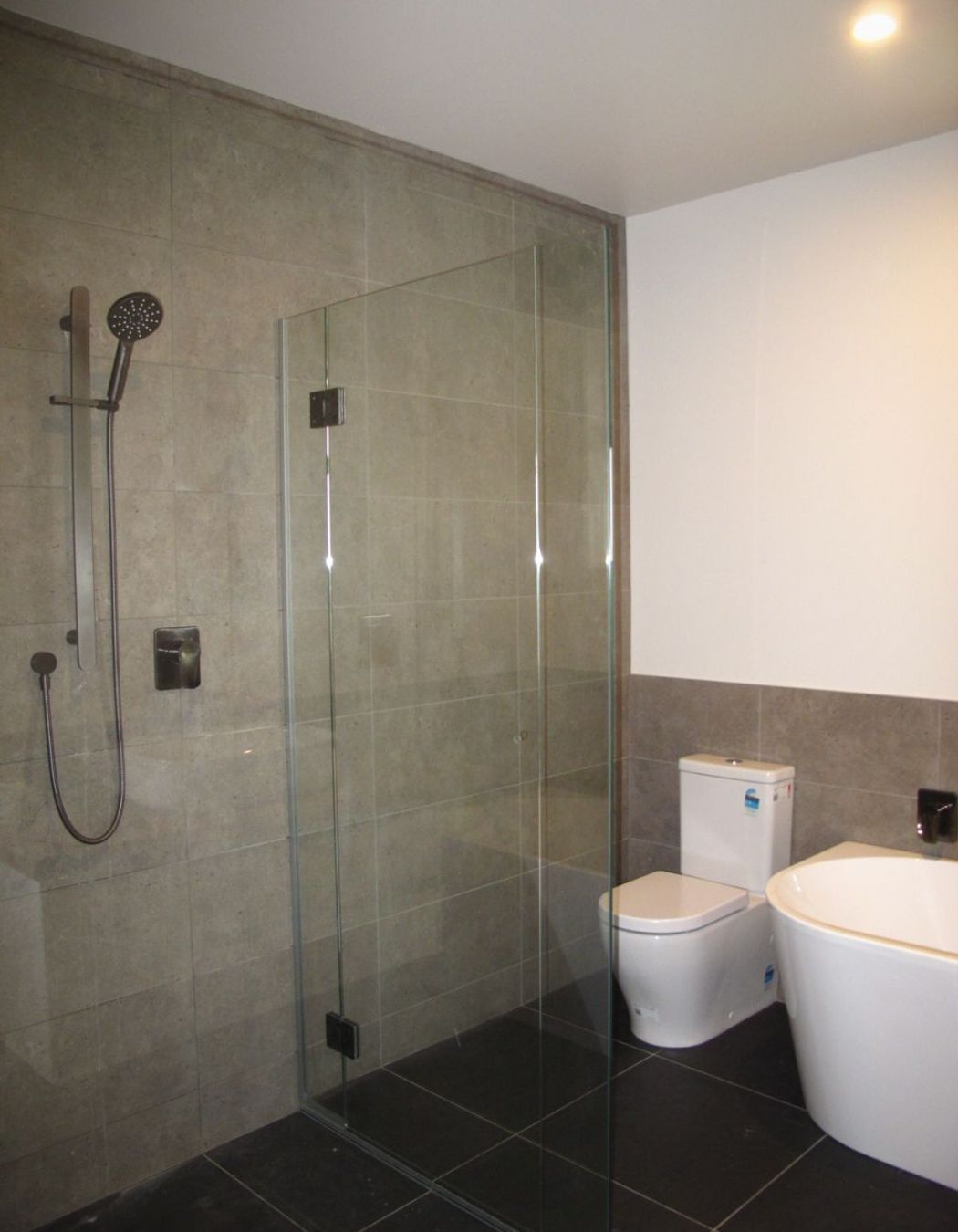 The main bathroom with tiled shower in a new residential build