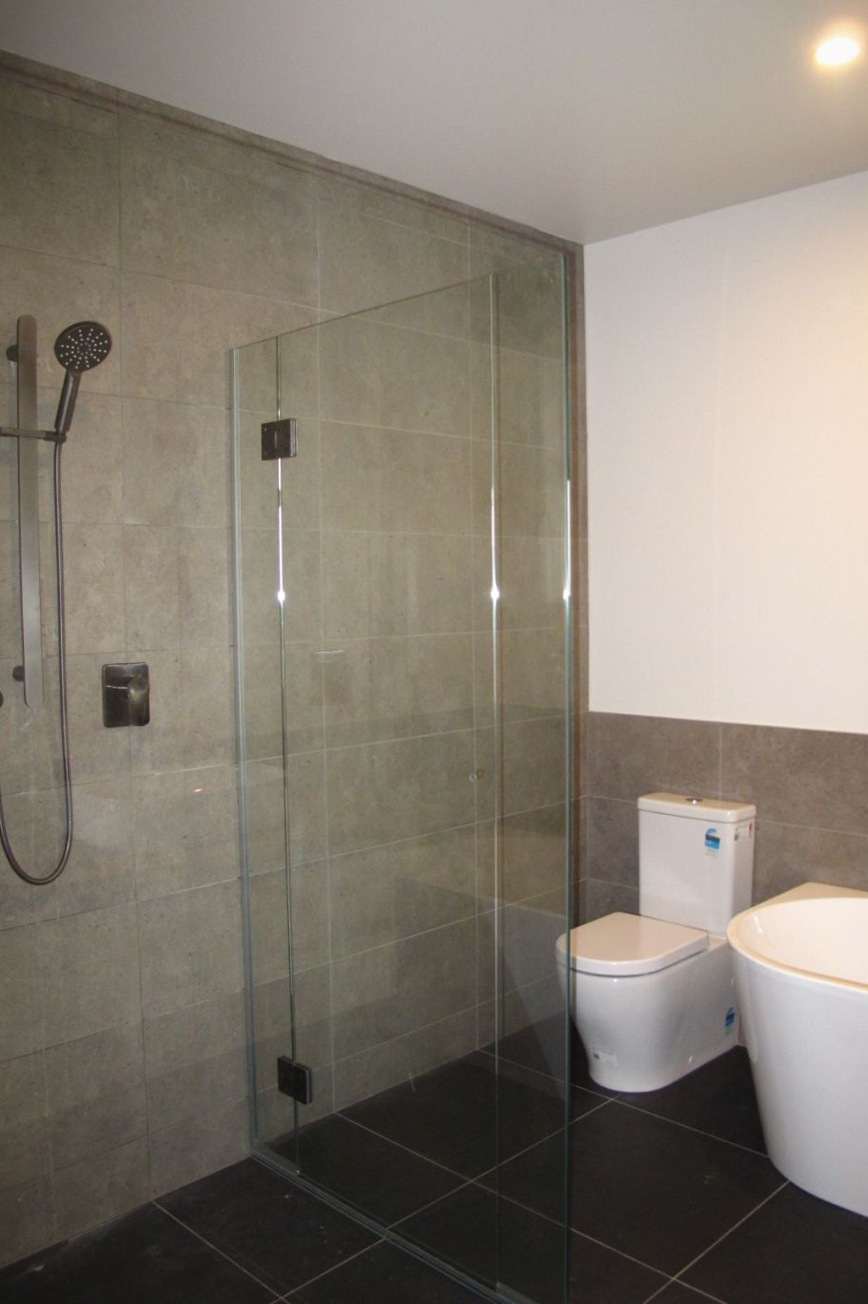 The main bathroom with tiled shower in a new residential build