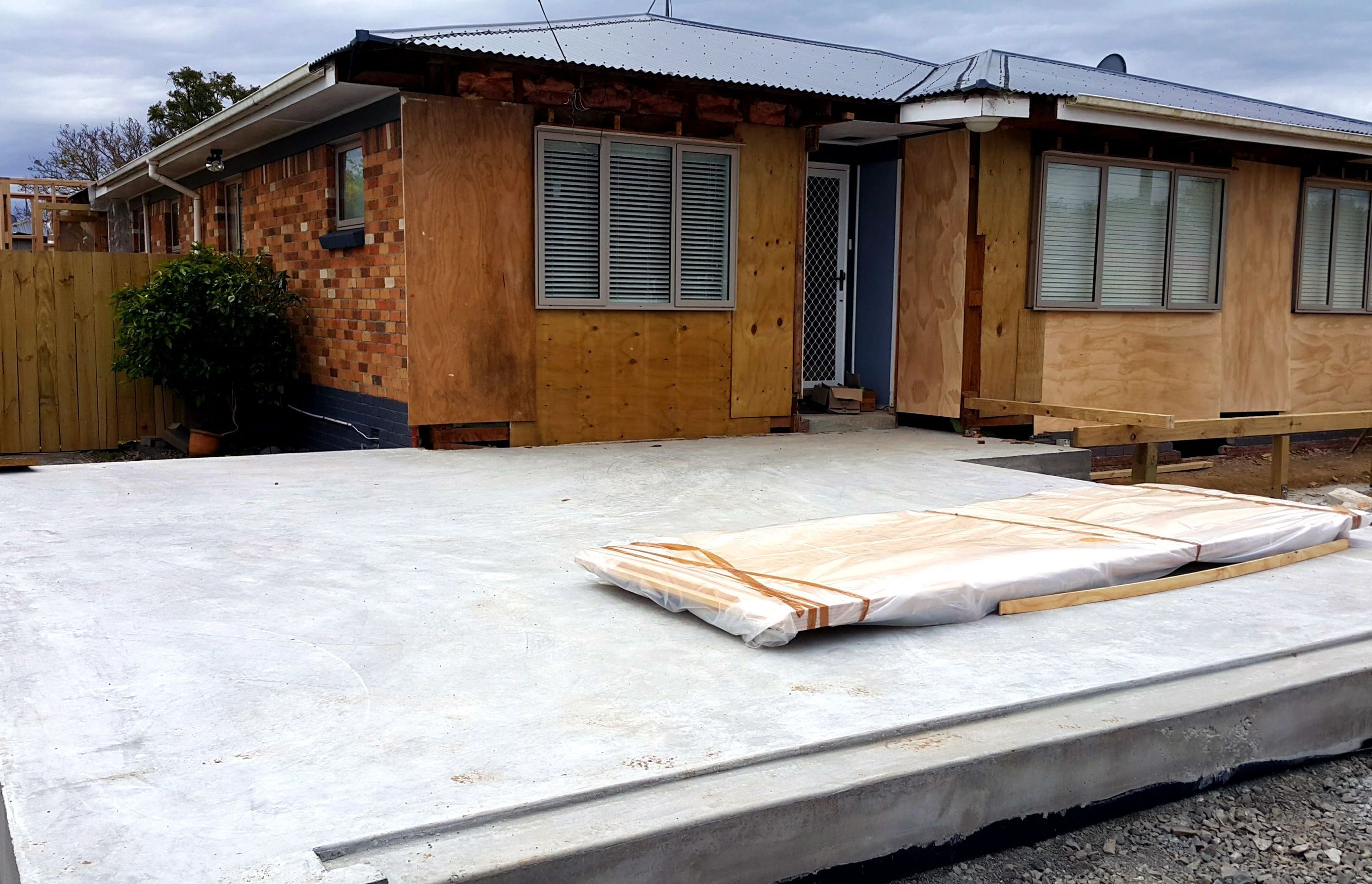 During Renovation - Bricks removed and garage floor pored, ready for framing 
