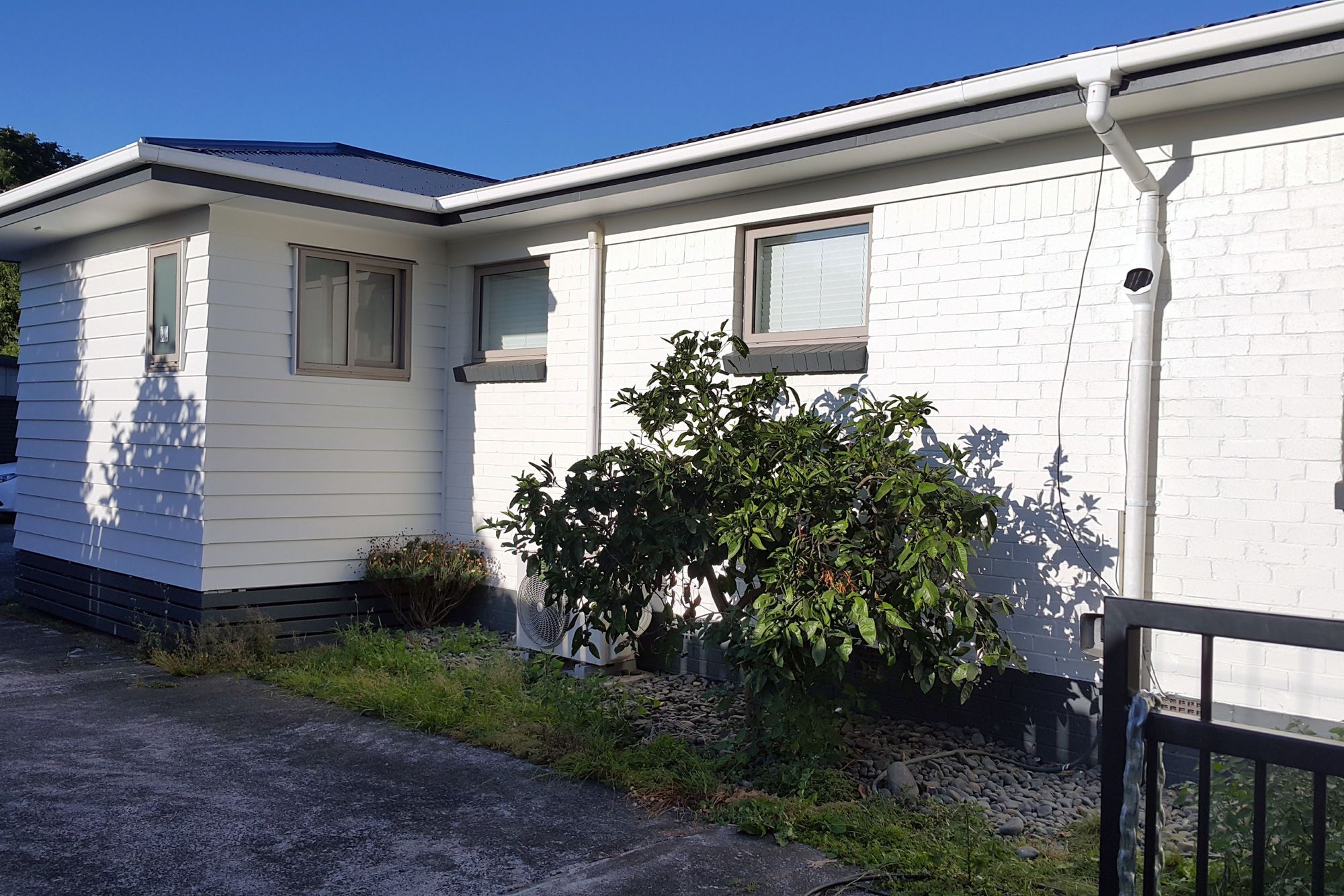 From red brick to white weatherboard brick combo 

