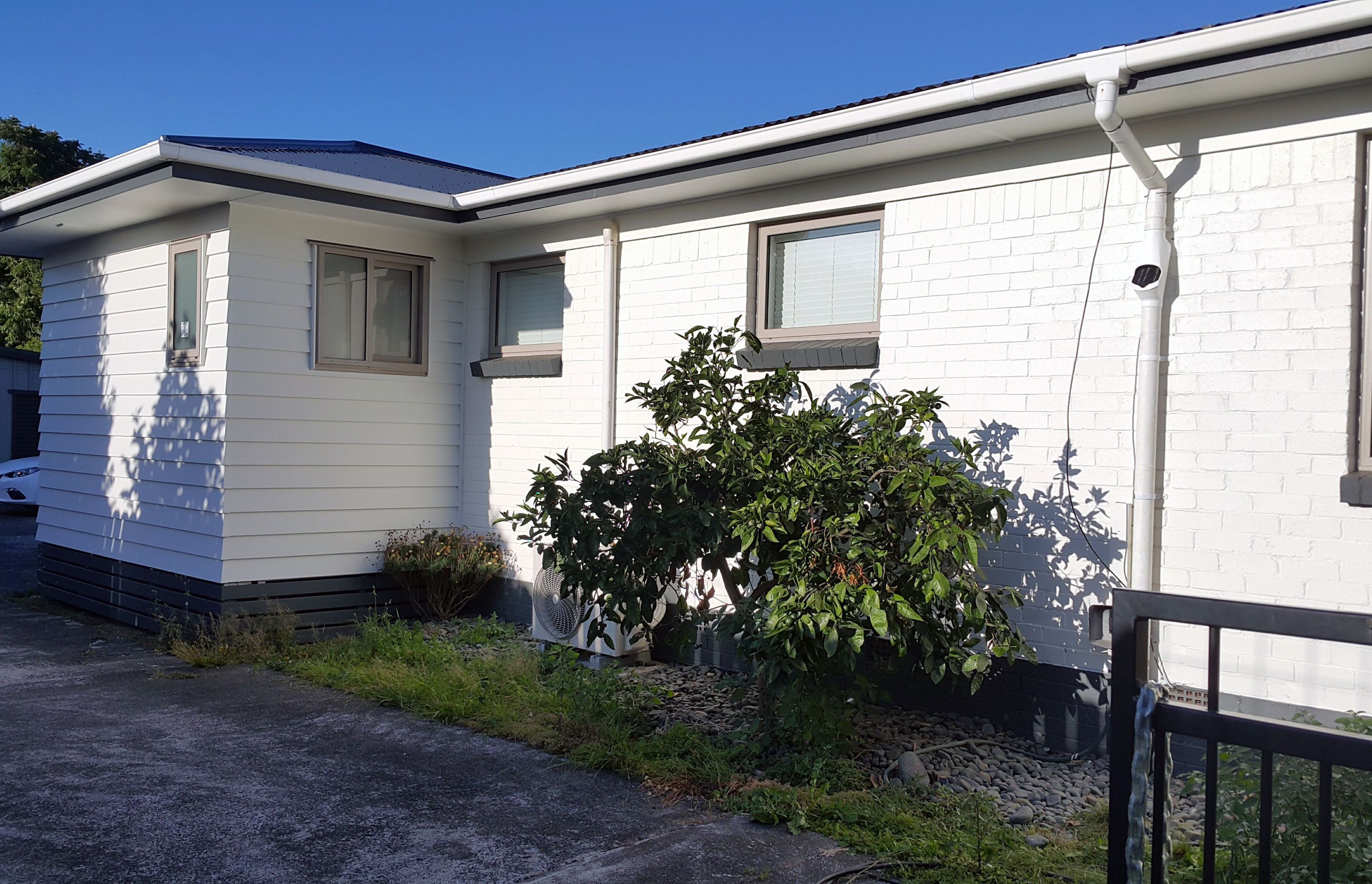 From red brick to white weatherboard brick combo 
