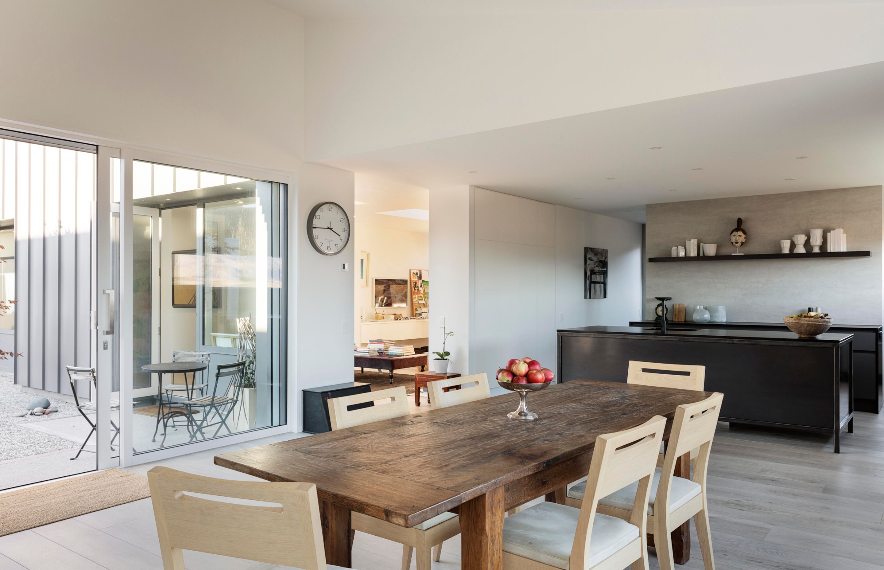 The hallway, and living spaces wrap around the courtyard and the ample glazing lets light into the internal spaces.