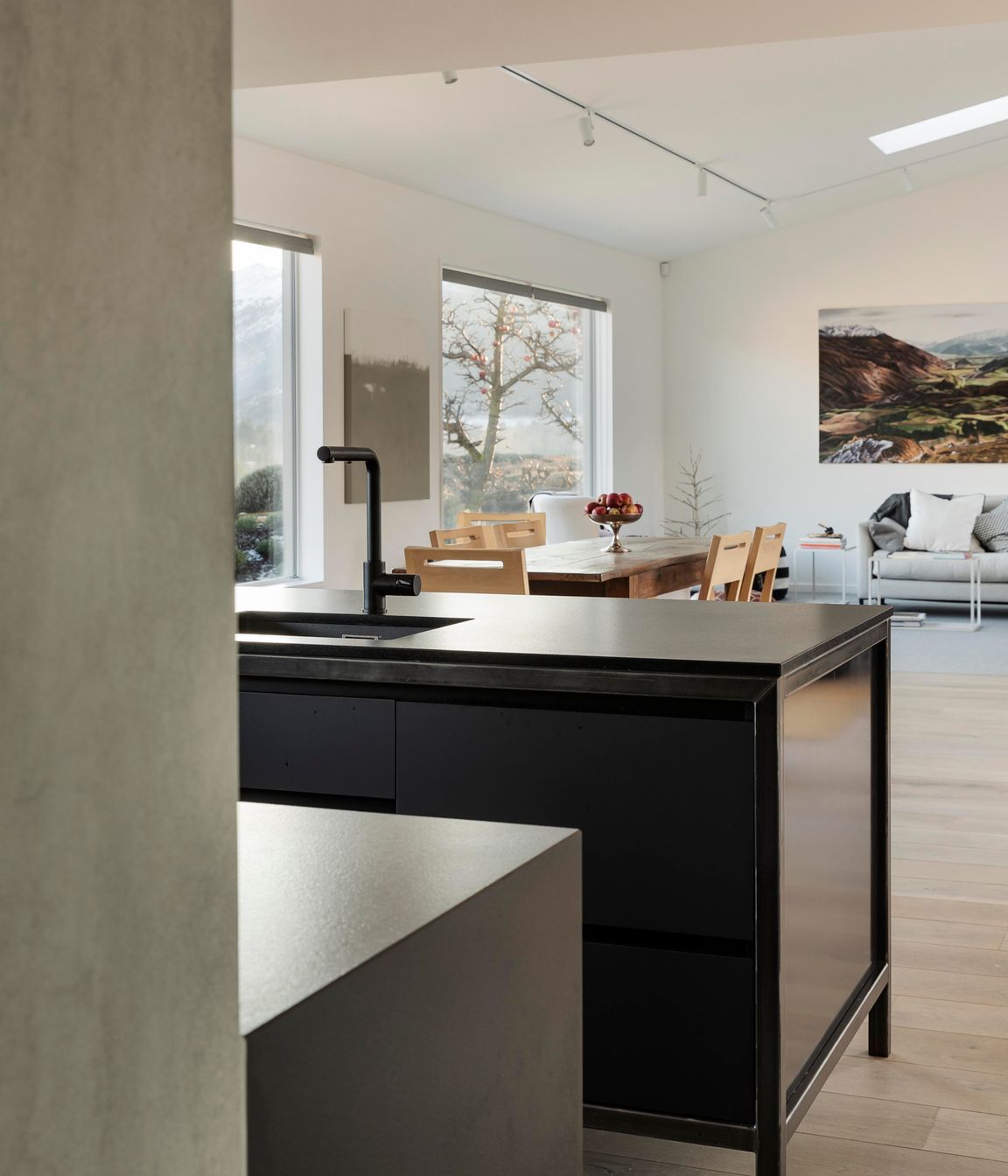 From the scullery, a view out to the kitchen and living spaces.