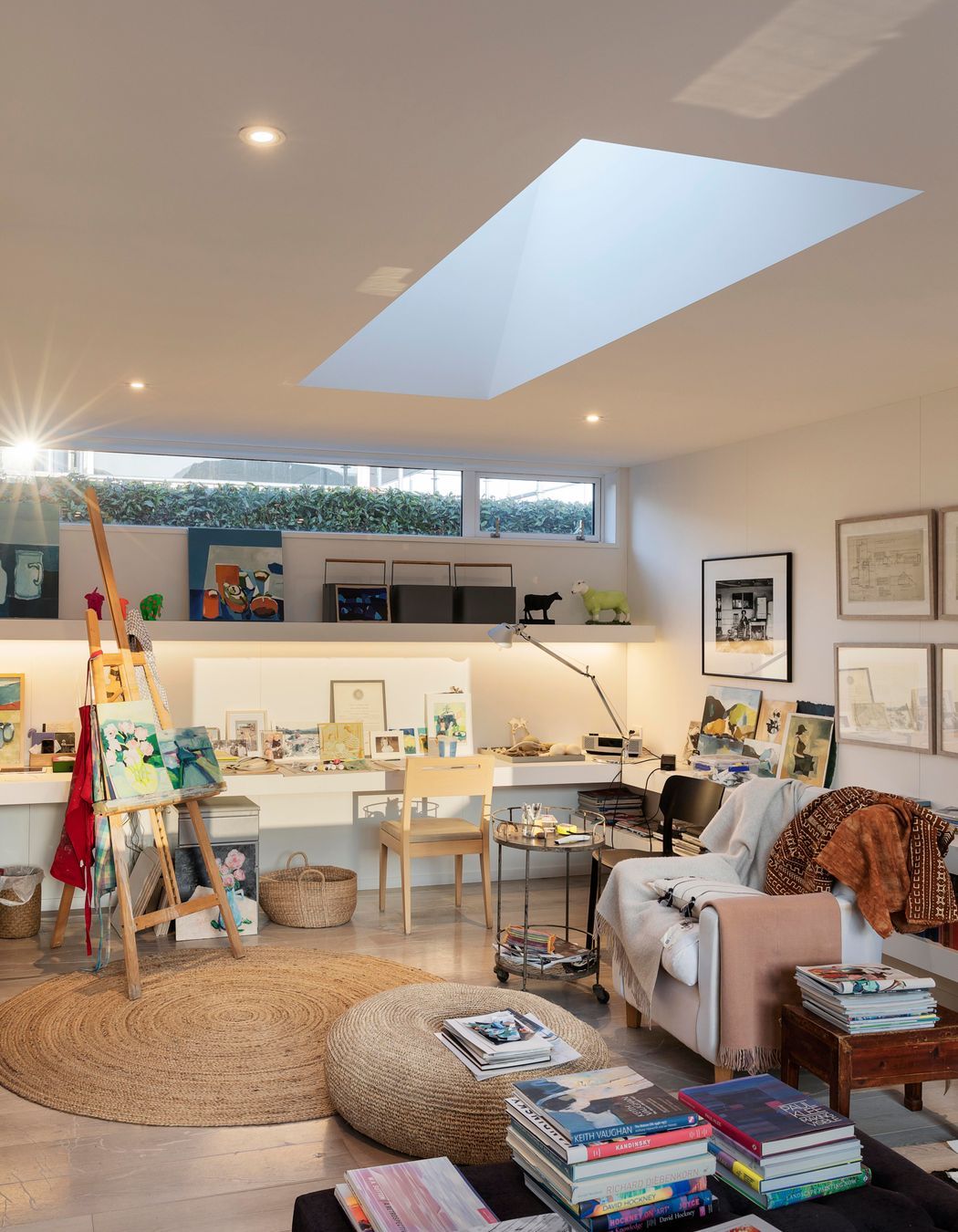 A skylight is cut into the centre of the studio ceiling so that the space is lit perfectly for painting.
