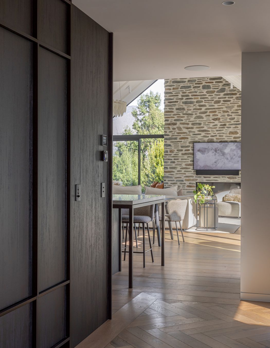 Dark natural timber joinery and parquet flooring in the entry hall