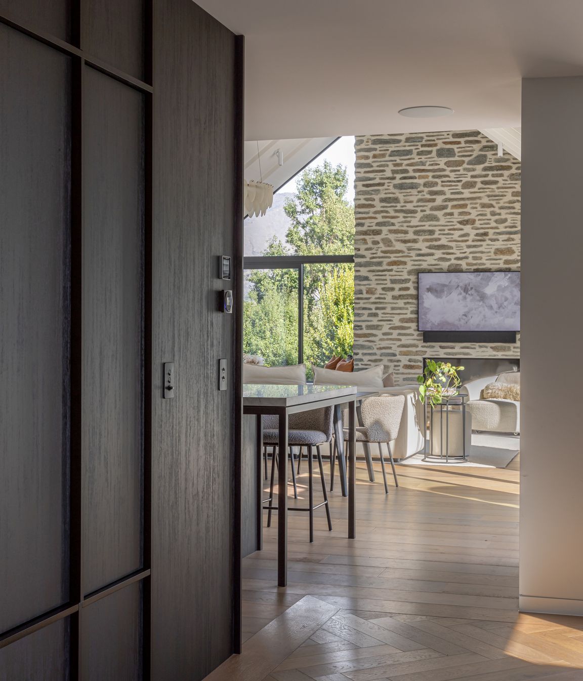 Dark natural timber joinery and parquet flooring in the entry hall