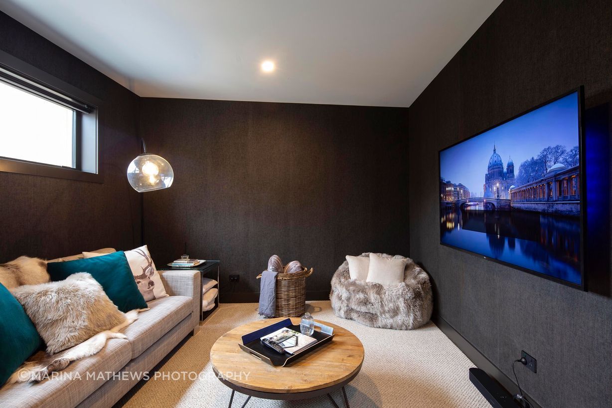 Family-media-room-with-wood-detailing-v3.jpg