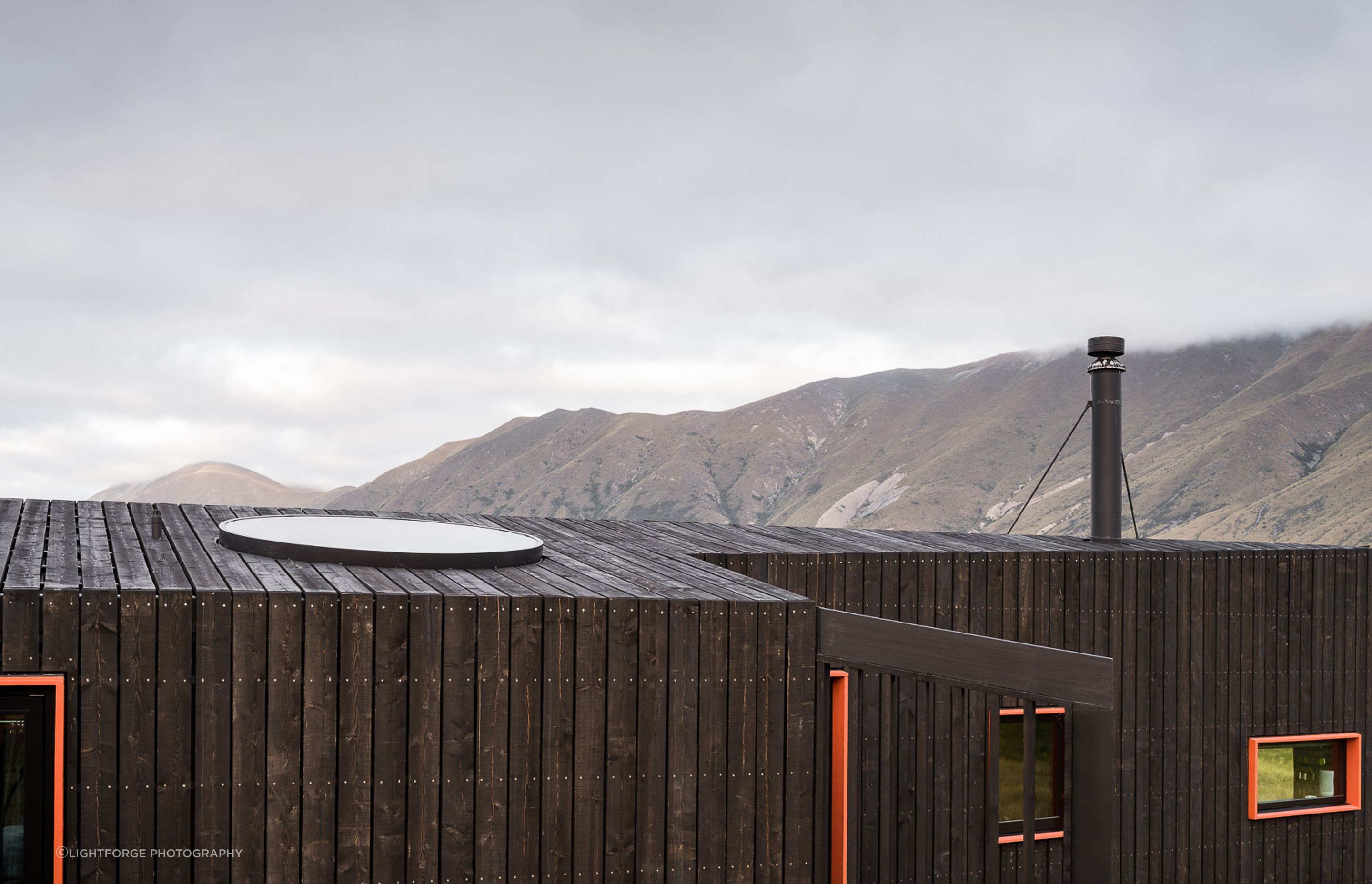 The circular skylight, which is positioned over the bed, provides views of the stars at night, as well as lazy views of the vast hazy skies during the day.