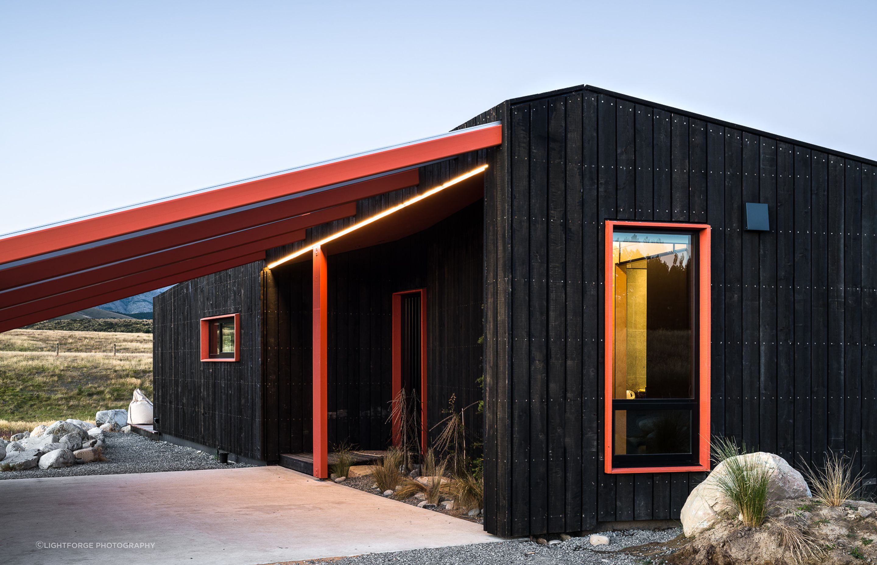 The rain screen cladding was chosen as it will weather in overtime and can also be removed and replaced as necessary. The use of LED 'light beams'—both externally and internally—helps accentuate the folds and creases within the architecture.