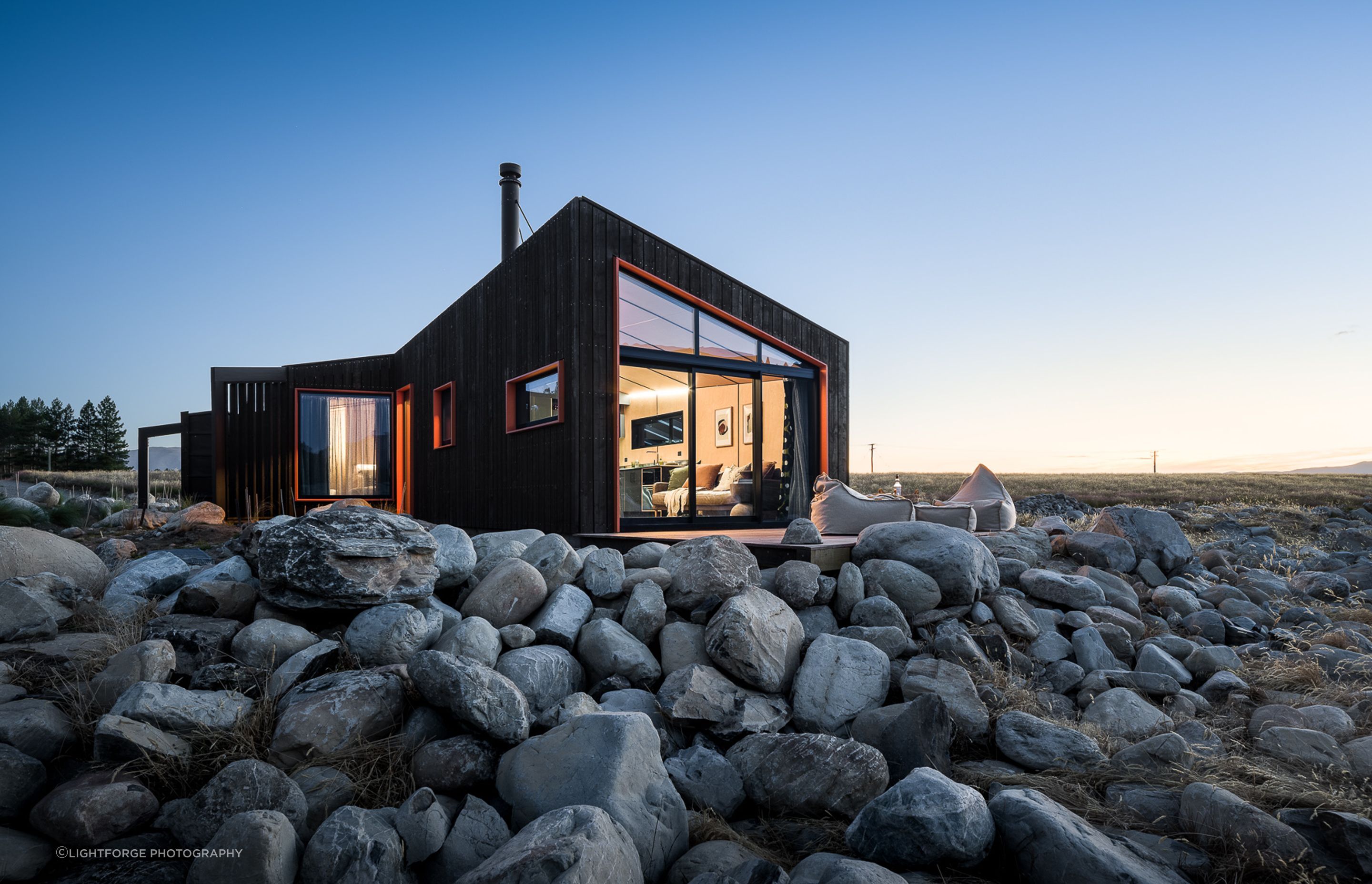 The shape and form of the cabin, along with the placement of the windows, was derived from plotting specific views from certain activities: lying in bed; washing the dishes; having a shower; and sitting or standing in the living area.
