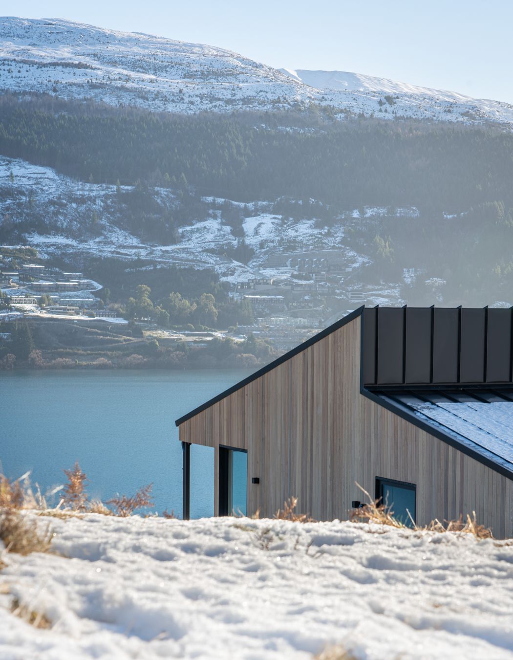 The clients wanted the landscape to be the hero and were keen to use cedar. The vertical shiplap cladding lends itself to the geometric house forms.