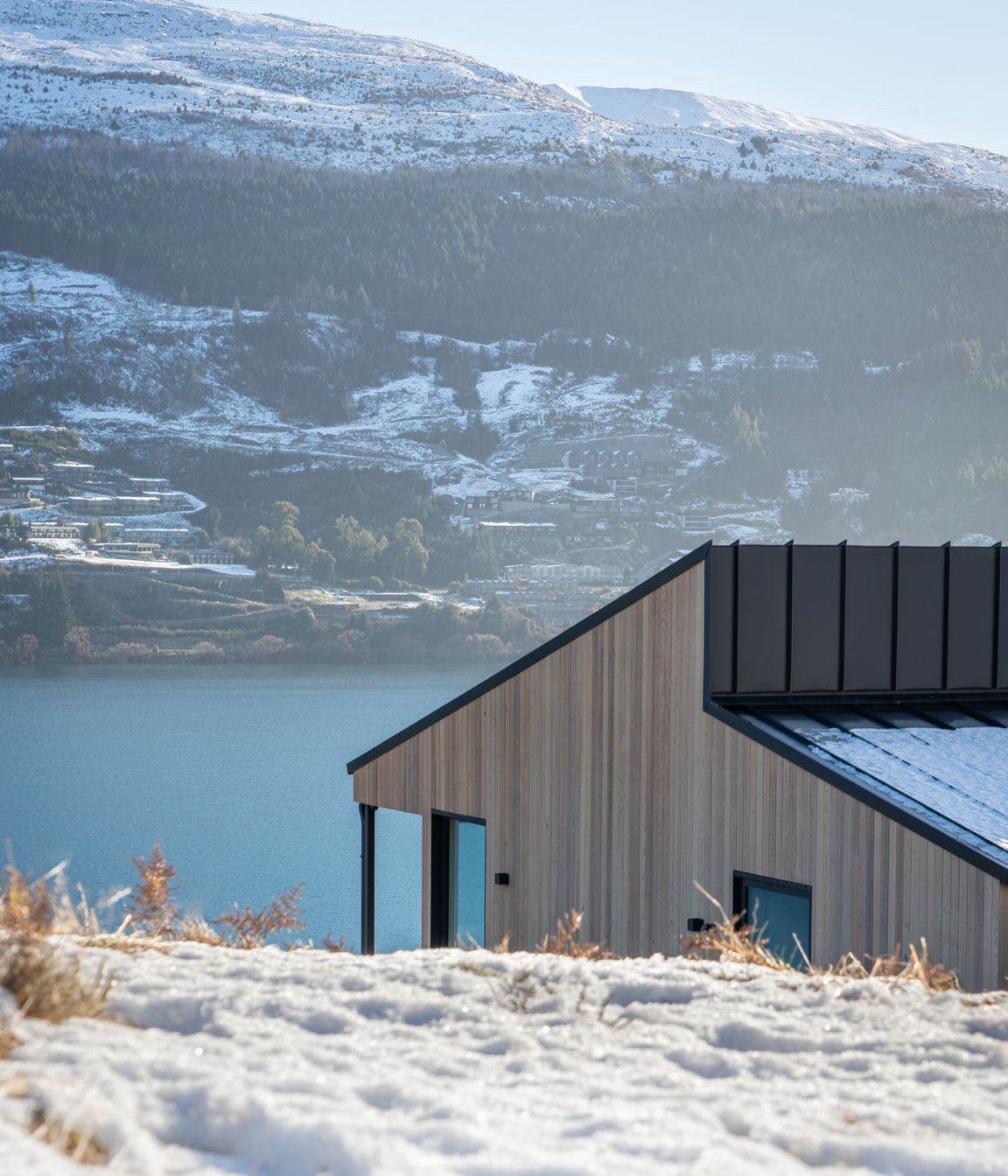 The clients wanted the landscape to be the hero and were keen to use cedar. The vertical shiplap cladding lends itself to the geometric house forms.