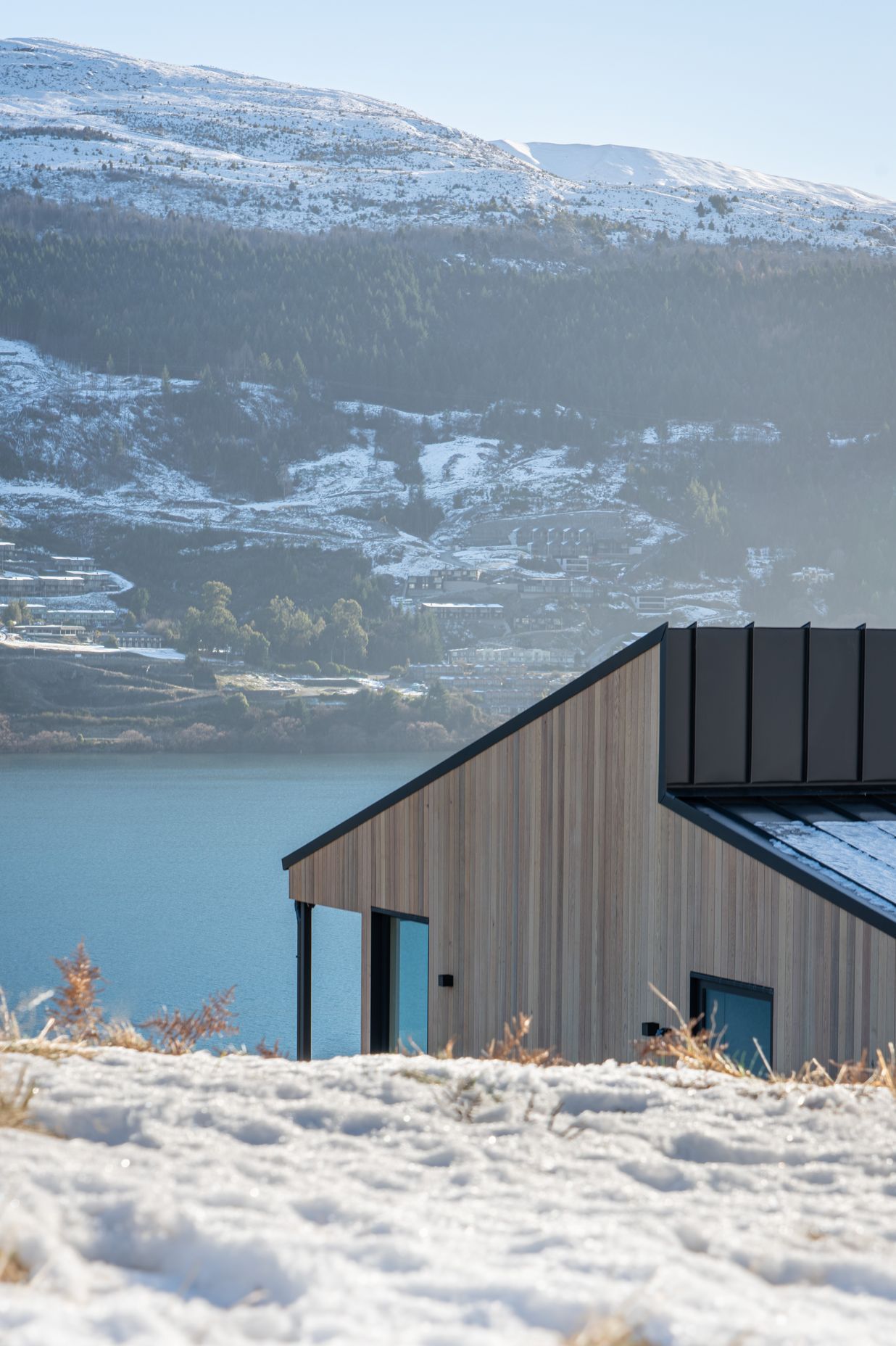 The clients wanted the landscape to be the hero and were keen to use cedar. The vertical shiplap cladding lends itself to the geometric house forms.