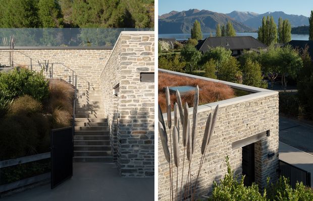 A split architectural photograph showing a landscaped stone courtyard and stairway on the left, and an elevated view of a contemporary stone-clad structure with a flat roof, entry opening, and surrounding garden on the right. The project sits in a mountainous landscape with a lake or broad water body visible beyond the trees. Pale coursed masonry, dark metal gates and roofing, restrained planting, and strong geometric wall forms create a refined contemporary exterior.