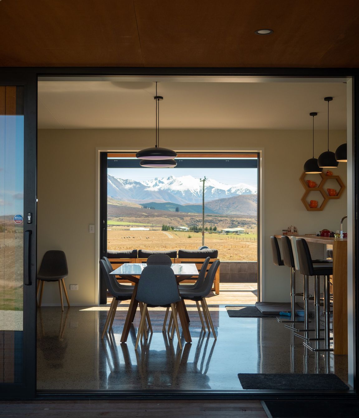 The view through the living area. “The architectural experience is quite a long journey,” says Beth. “It's about getting to know clients really well, early on, so we spent the time up front actually getting to know the clients and their unique needs and lifestyles.”