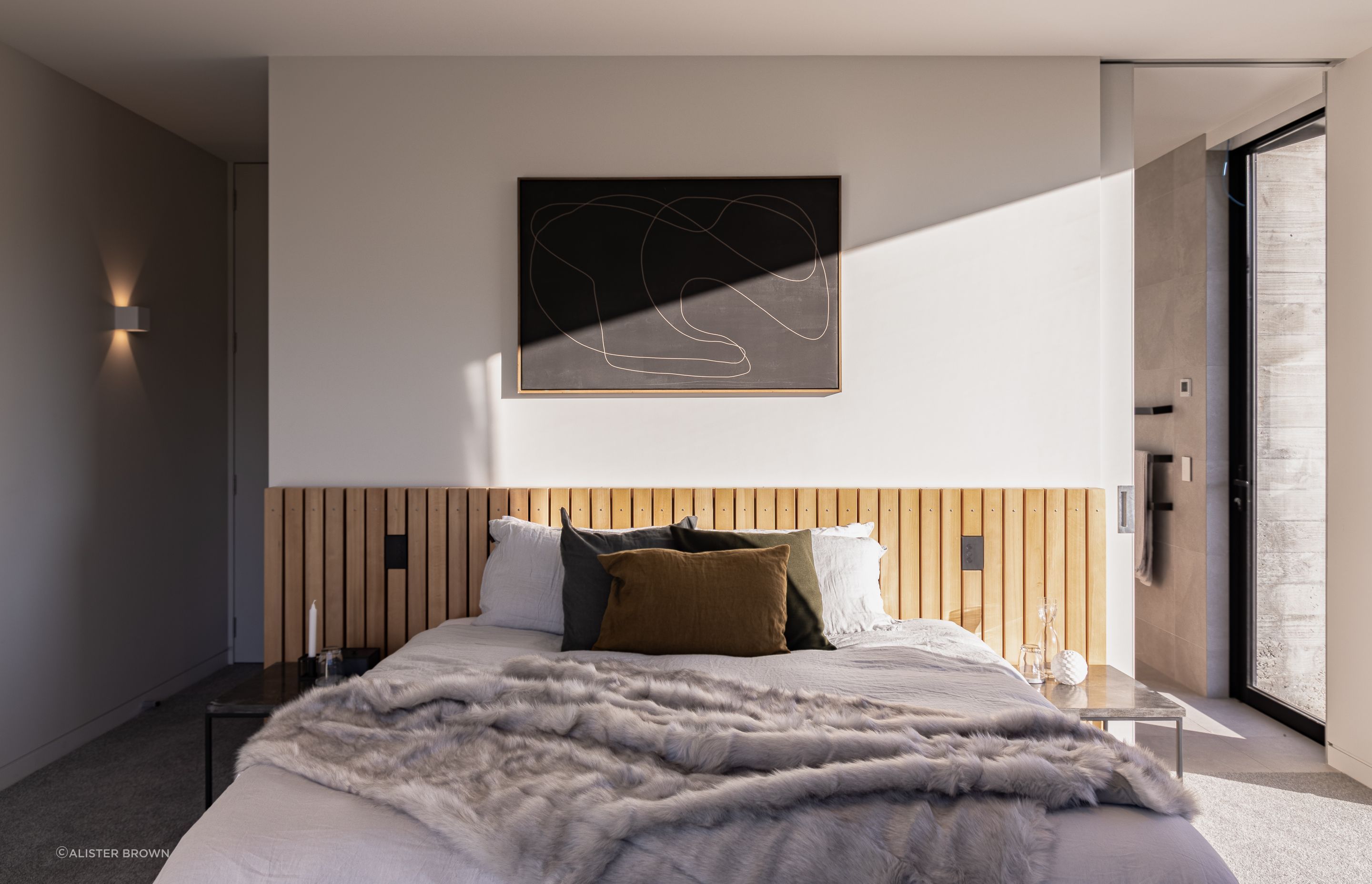A modern industrial aesthetic continues through the dwelling.