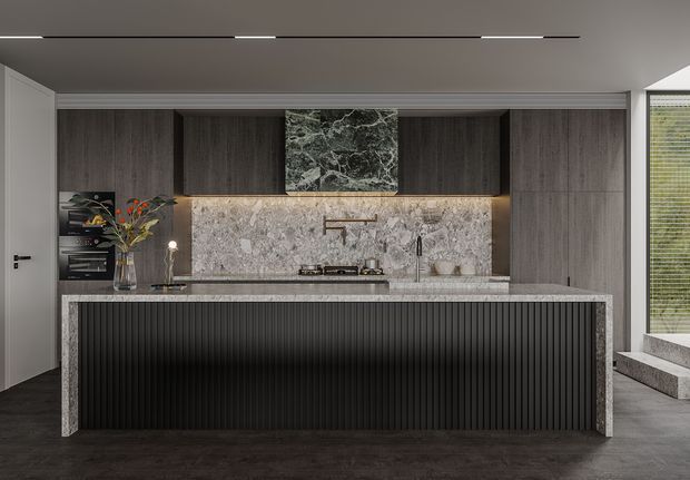 A sophisticated contemporary kitchen with a large island featuring a vertically ribbed dark front and pale stone sides and benchtop. The rear wall has a matching stone splashback, dark wood-grain cabinetry, integrated appliances, a gas cooktop, and a central marble-look feature panel. Dark flooring, recessed linear lighting, and minimal black fixtures create a refined, monochromatic interior.
