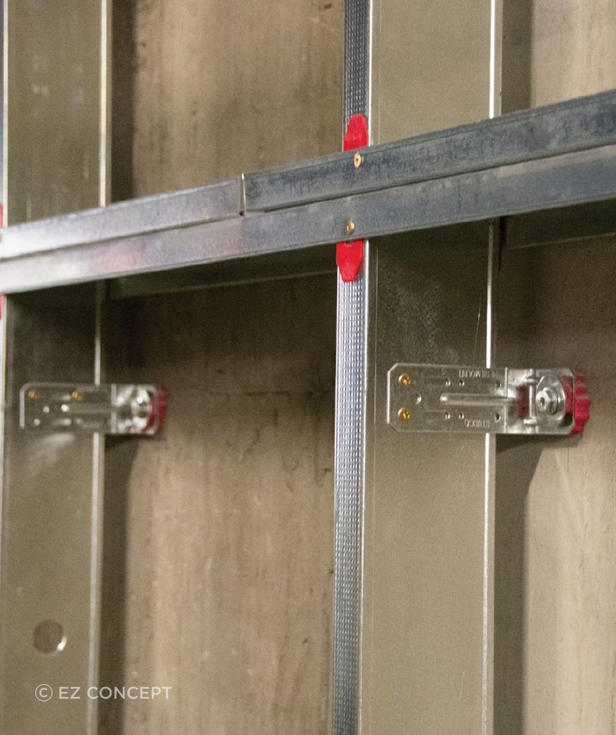 The M48R Right Angle Resilient Mount Bracket fixed to a stud for sound isolation purposes.