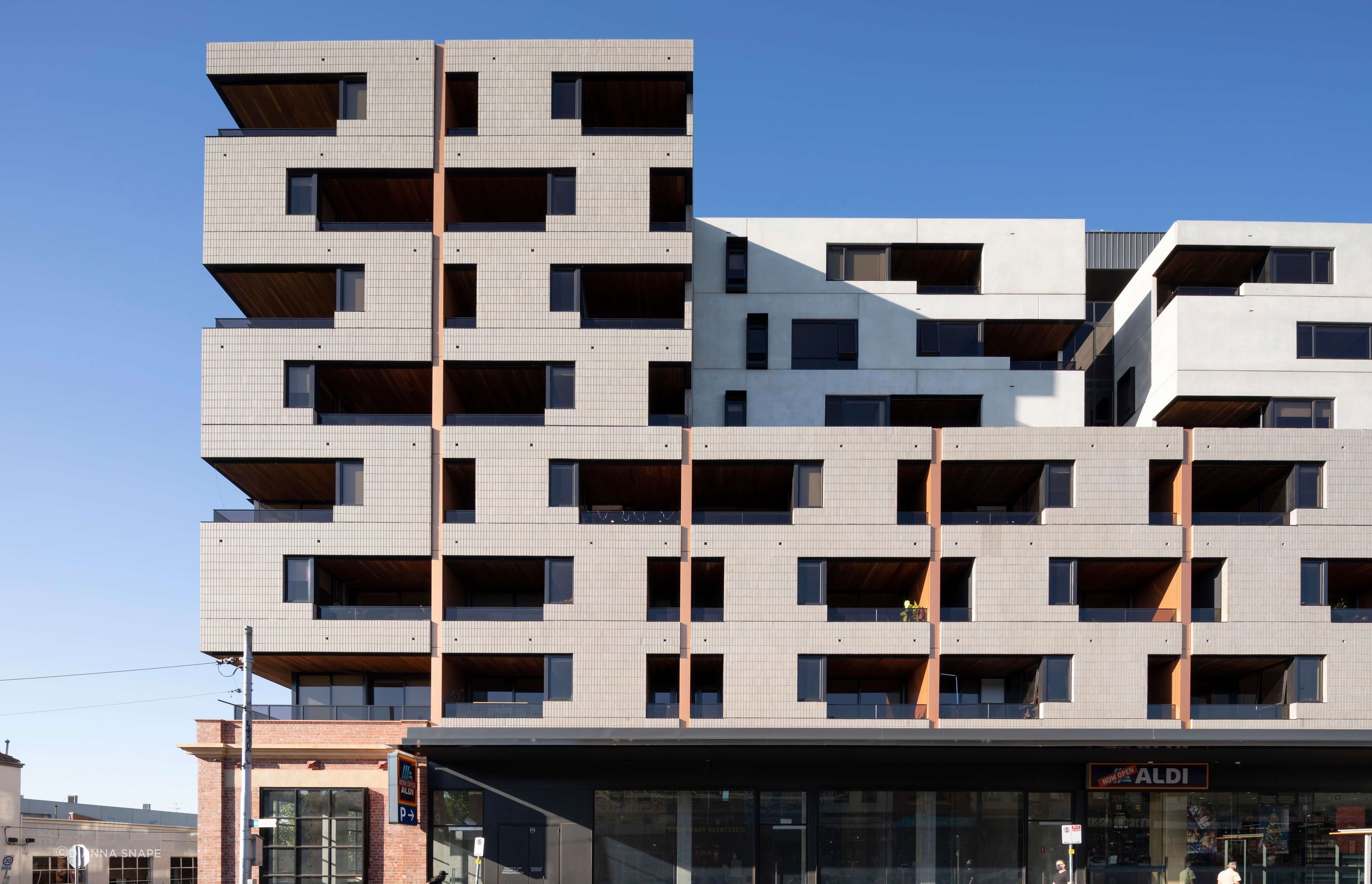 The play of shadow, texture and depth provide visual interest to the streetscape