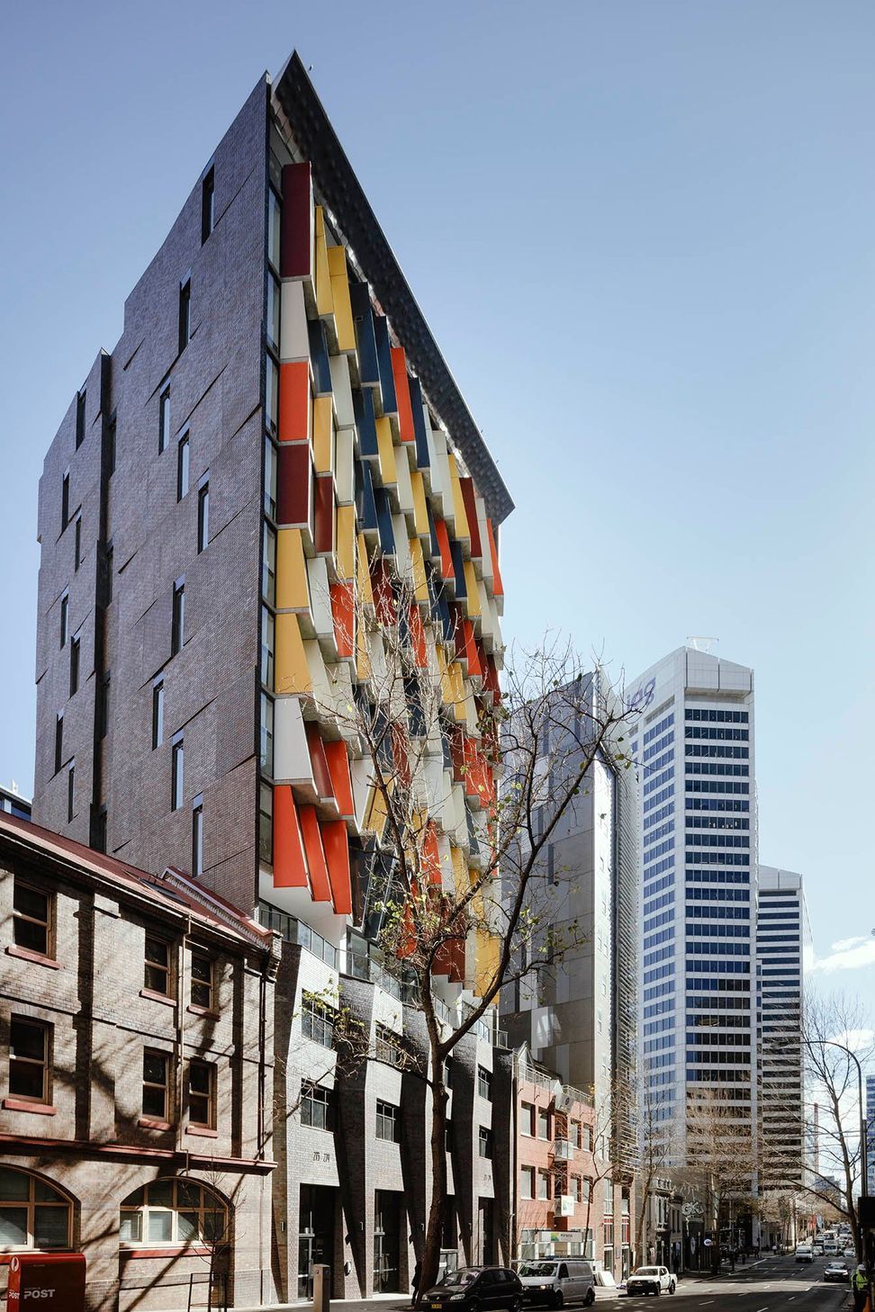 The angled brick inlay side facade featuring Iron Mountain facing tiles to match the full brick podium