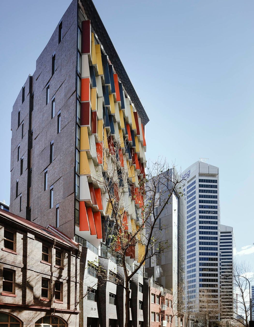 The angled brick inlay side facade featuring Iron Mountain facing tiles to match the full brick podium