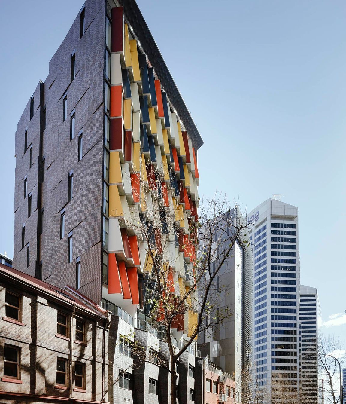 The angled brick inlay side facade featuring Iron Mountain facing tiles to match the full brick podium