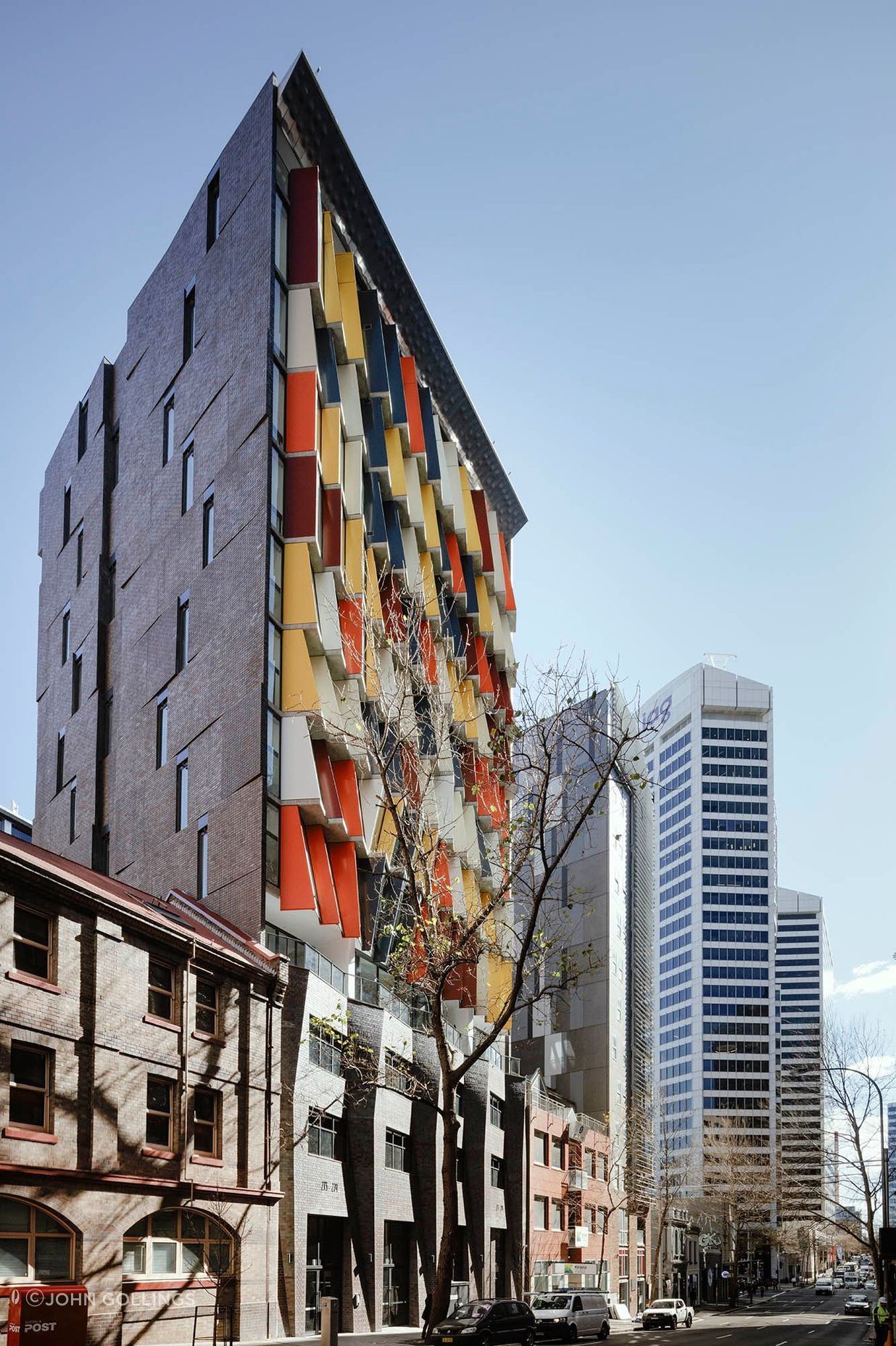 The angled brick inlay side facade featuring Iron Mountain facing tiles to match the full brick podium