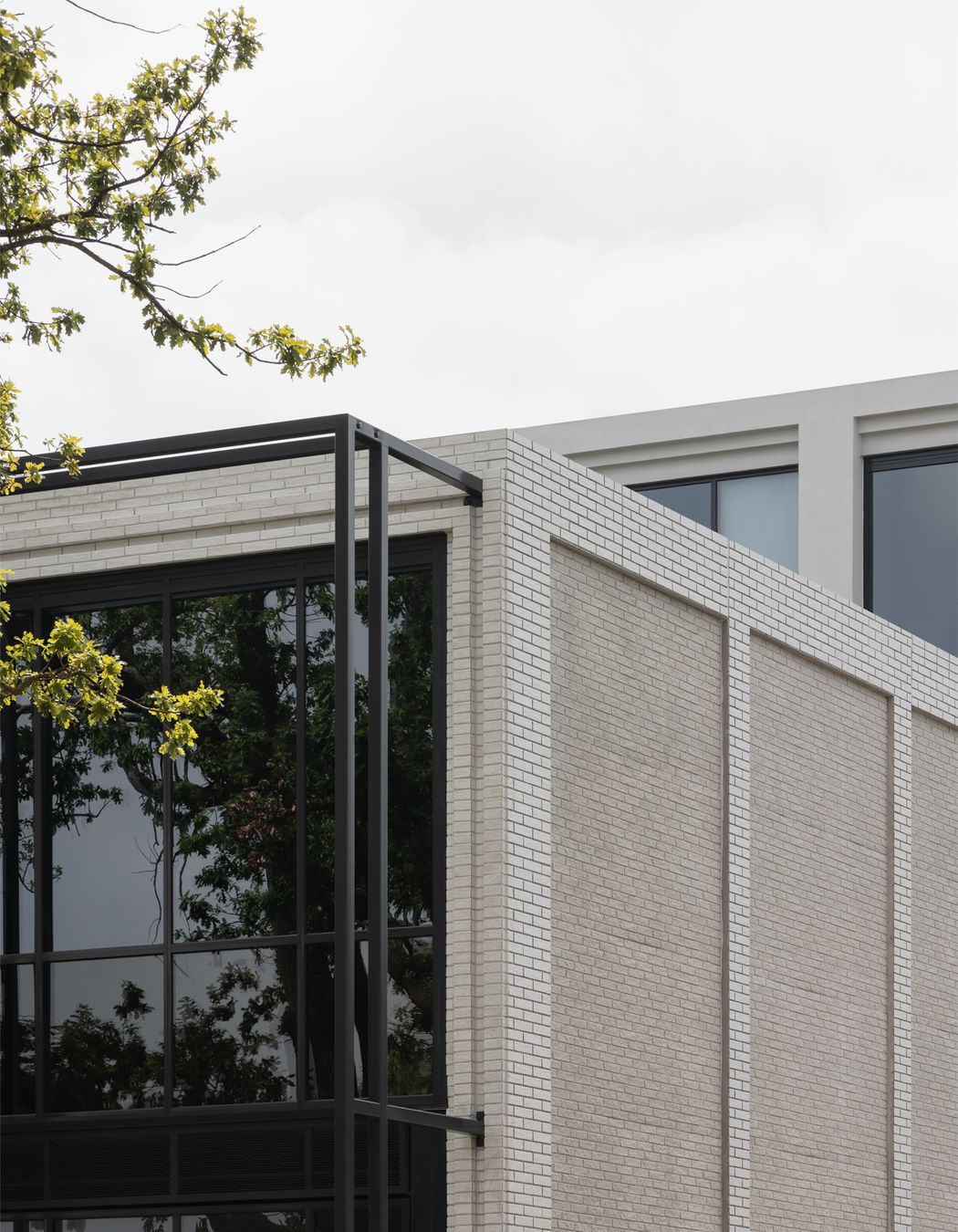 Mattoncino Grande Bianco brick tiles create a beautifully textured boundary walls on the residential side