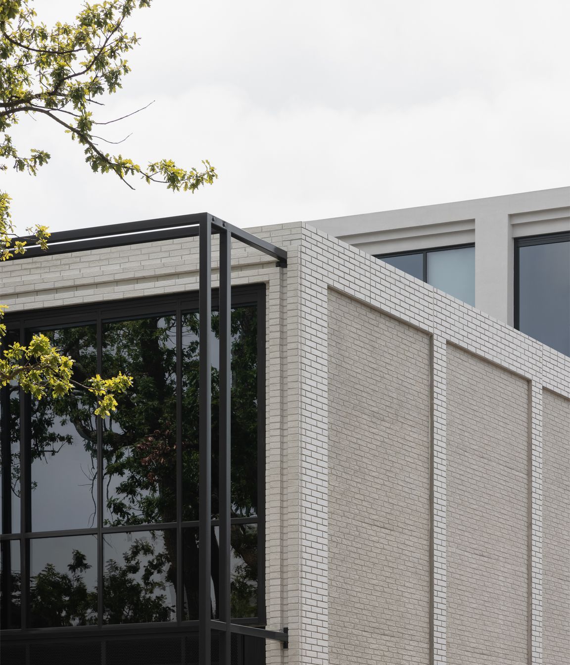 Mattoncino Grande Bianco brick tiles create a beautifully textured boundary walls on the residential side