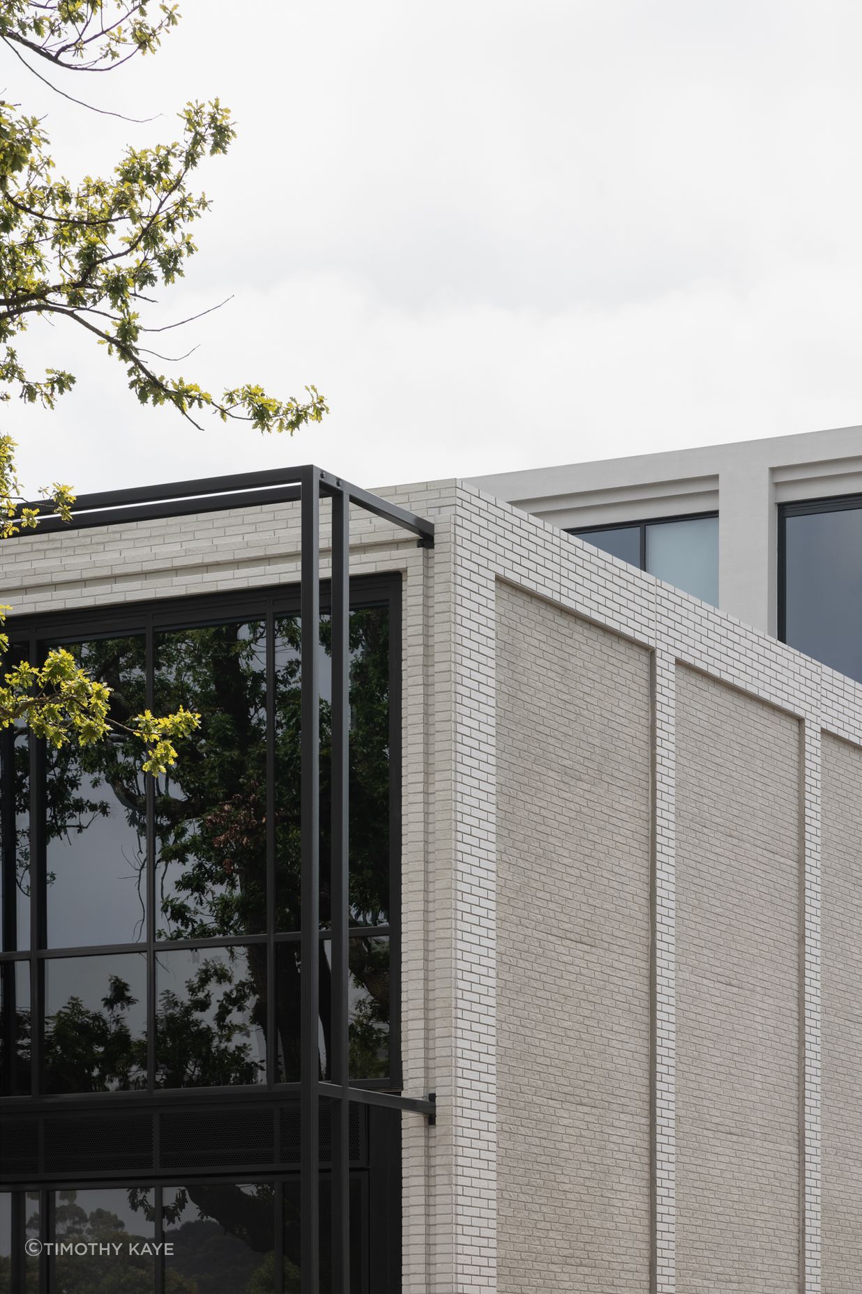 Mattoncino Grande Bianco brick tiles create a beautifully textured boundary walls on the residential side
