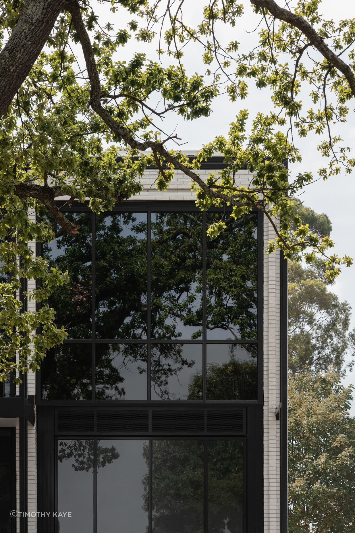 Brick Inlay delivers a finely tuned facade, featuring Mattoncino Grande Bianco brick tiles on the residential side