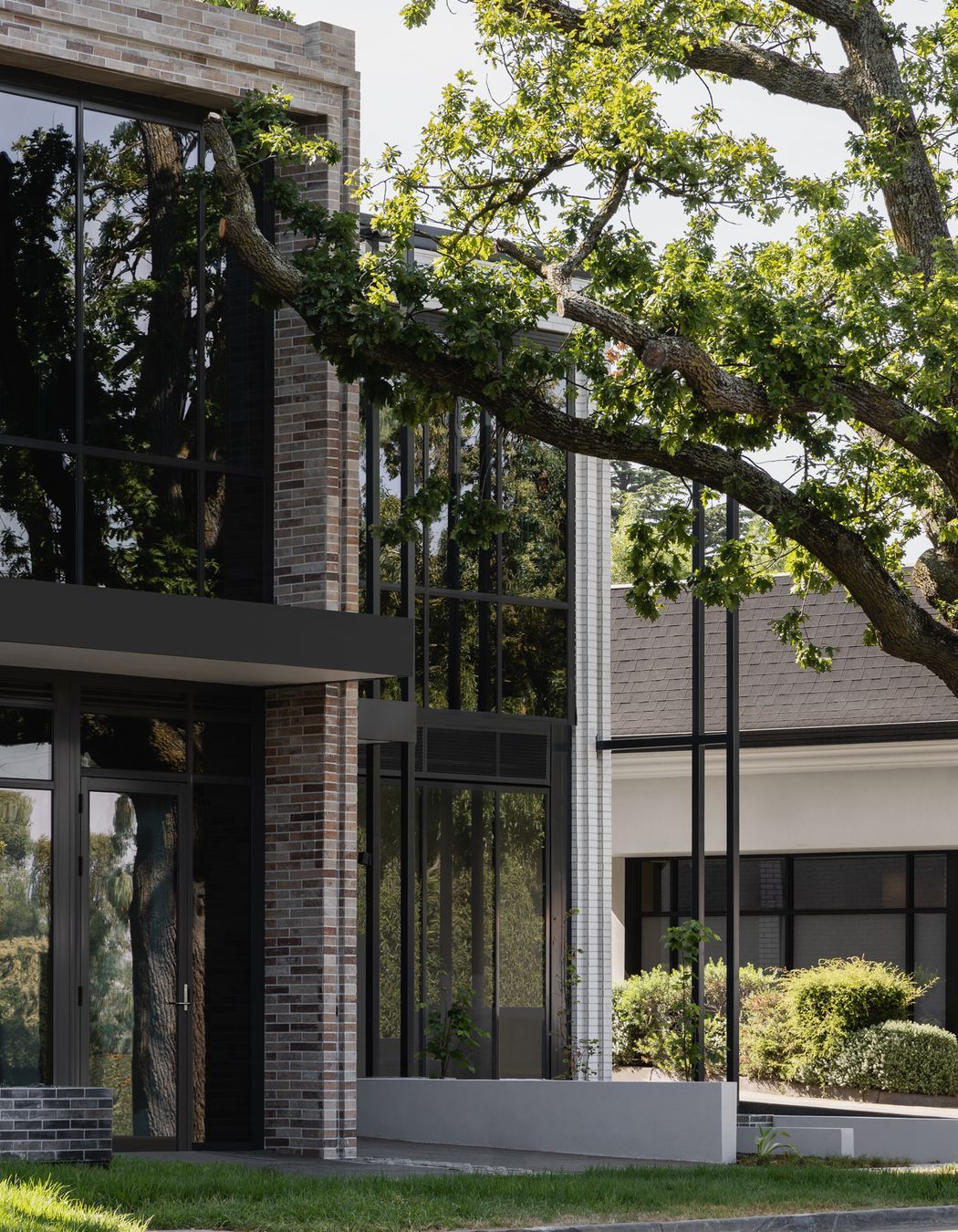 Contrasting coloured brick defines the commercial & residential sides of the building