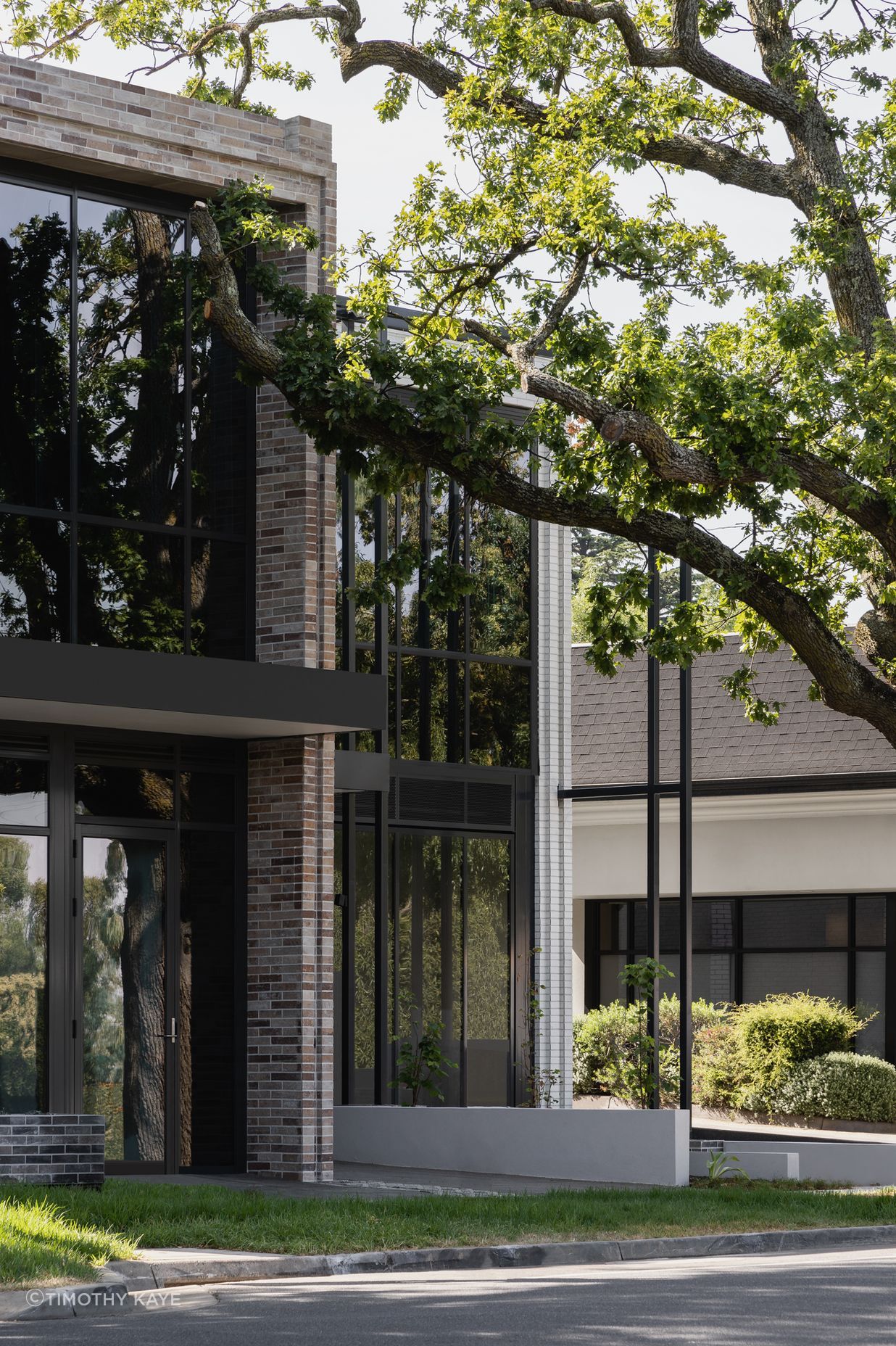 Contrasting coloured brick defines the commercial & residential sides of the building