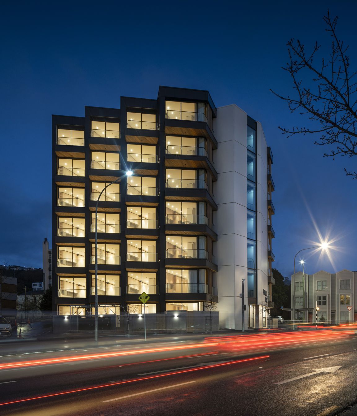 Each apartment features a balcony with views of the city and its maunga.
