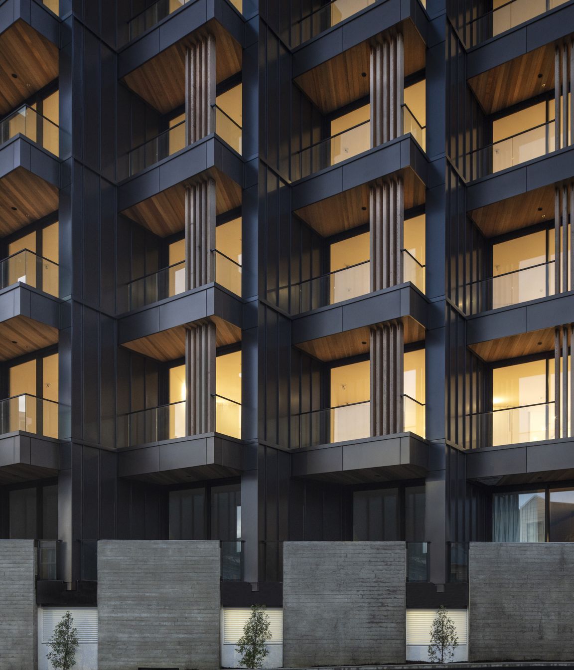 The materiality of the exterior features shades of warm bronze long run metal cladding, paired with cedar soffits.