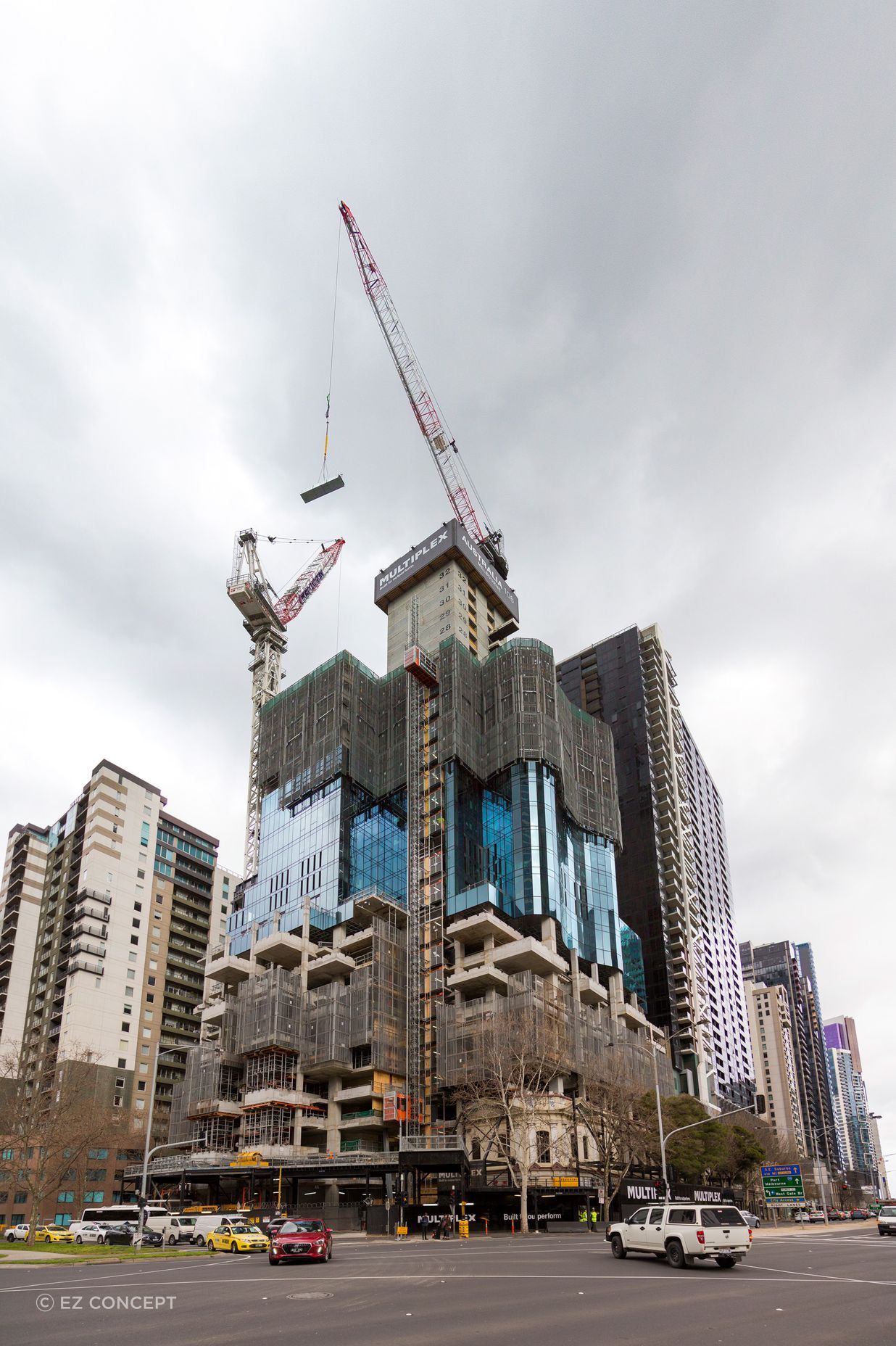 The progression of Australia 108 from its early construction (left) to completion (right).